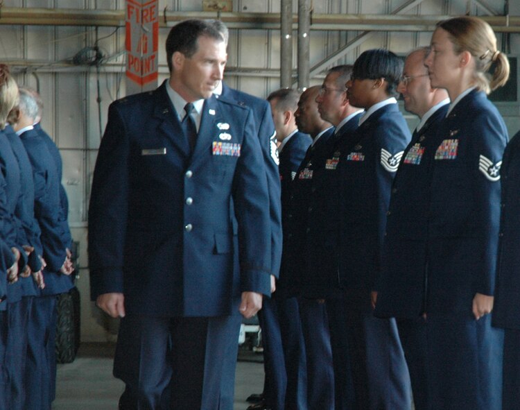 Captain Brad Warnick, 919th Logistics Readiness Squadron director of operations, reviews the reservists in his squadron in an annual open ranks inspection during the April unit training assembly weekend here.  The 919th LRS holds annual open ranks inspections to ensure personnel meet standards of dress and appearance.  The event also afforded an opportunity to practice formation movements and commands. (U.S. Air Force photo/Senior Airman Jon McCallum)