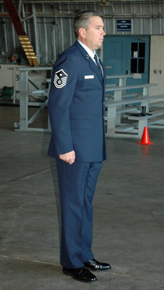 Master Sgt. Dan Landrum, 919th Logistics Readiness Squadron first sergeant, calls the reservists in his squadron to attention in an annual open ranks inspection during April’s unit training assembly weekend here.  The 919th LRS holds annual open ranks inspections to ensure personnel meet standards of dress and appearance.  The event also afforded an opportunity to practice formation movements and commands. (U.S. Air Force photo/Senior Airman Jon McCallum)