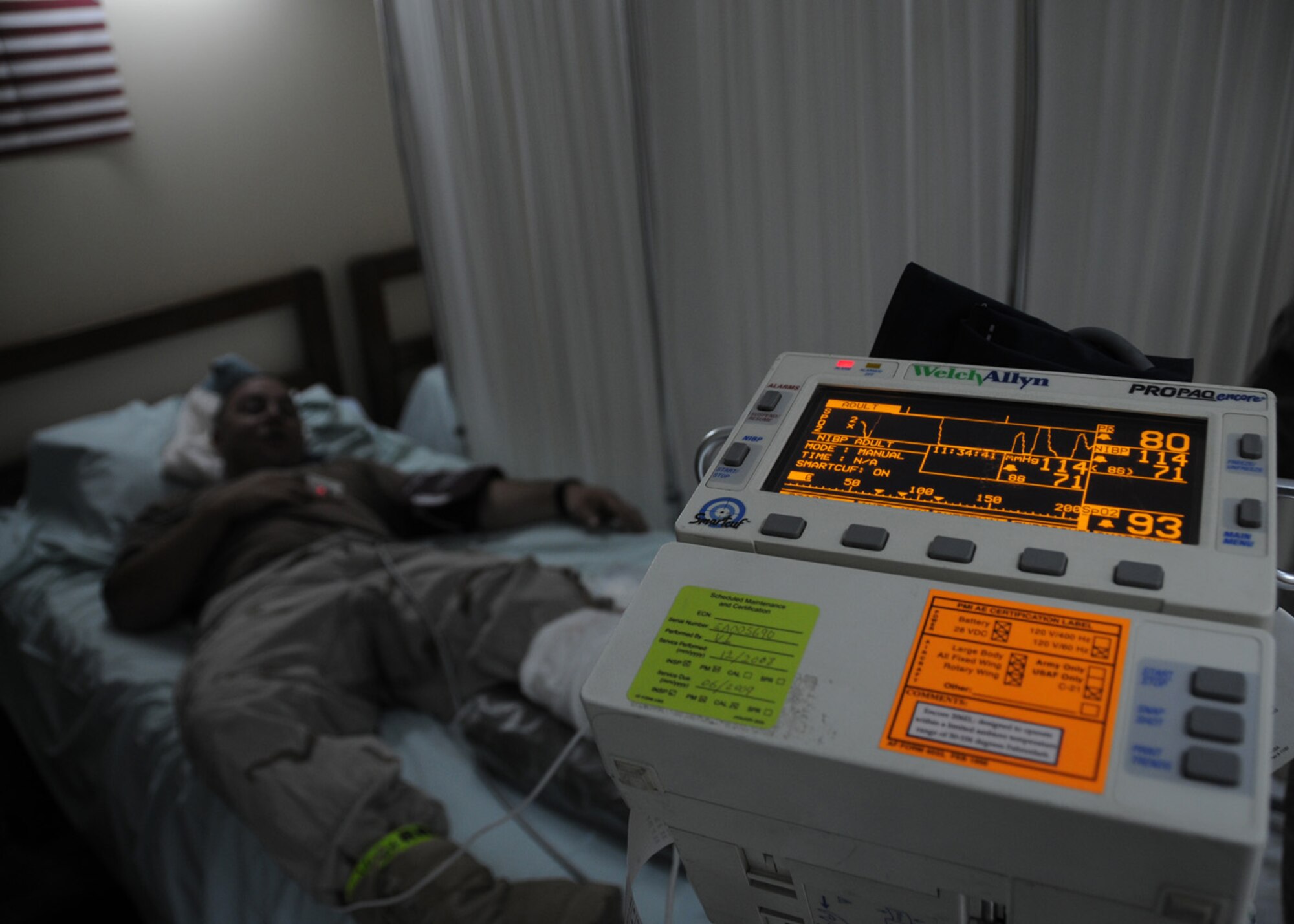 SOUTHWEST ASIA -- Senior Airman Richard Berni, 386th Expeditionary Civil Engineer Squadron simulated patient, rests and waits for his vital signs to be checked after being transferred from the initial scene during a Base Response and Readiness Exercise at an air base in Southwest Asia, April 13. In the event of an emergency, patients are assessed and treated by most critical patients first to minimal care. Airman Berni is currently deployed from Francis S. Gabreski Air National Guard base, N.Y., and is originally from Manorville, N.Y.  (U.S. Air Force photo/ Senior Airman Courtney Richardson)