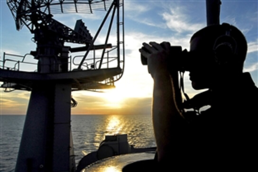 U.S. Navy Seaman Anthony Fortunate stands port forward lookout watch on the island structure aboard the aircraft carrier USS John C. Stennis in the Pacific Ocean, April 8, 2009. Stennis is on a scheduled six-month deployment to the western Pacific Ocean.