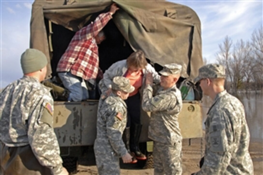 North Dakota National Guard soldiers evacuated a campground site as they help fight flooding in Minot, N.D., April 14, 2009.