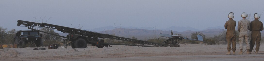 Marines with Marine Unmanned Aerial Vehicle Squadron 3 wait for the go to launch the UAV at the Tacts field in the Barry M. Goldwater Range April 15, 2009. As part of VMU-3, they arrived in Yuma March 23, 2009 to participate in training exercises during the Weapons and Tactics Instructors course. VMU-3 was formed Sept. 12, 2008.