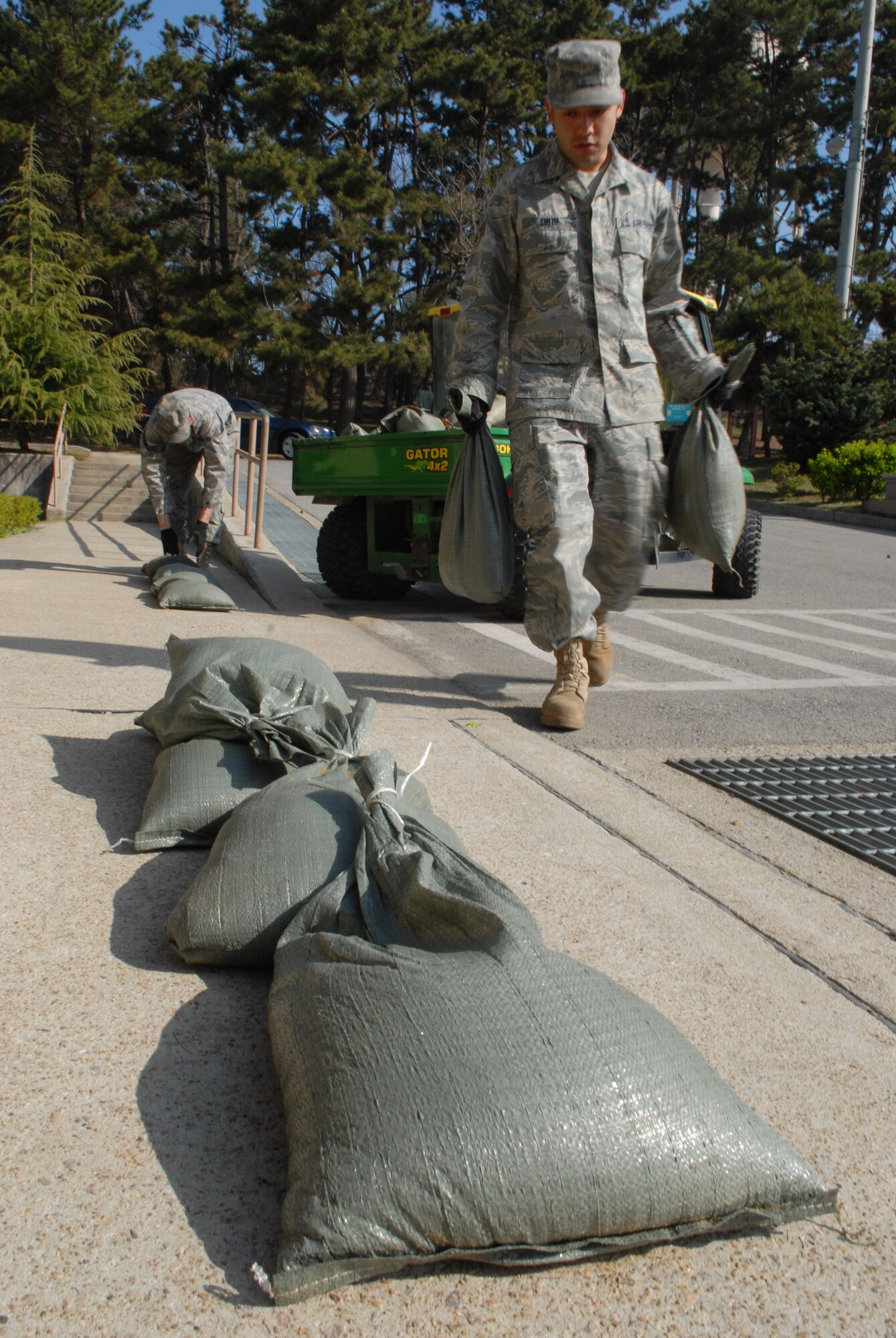 Senior Airman Nathaniel Smith, 8th Medical Group, uses sand bags to harden the 8th Medical Group facility in preparation for the upcoming Operational Readiness Inspection at Kunsan Air Base, Republic of Korea, April 17, 2009. Build up and hardening of facilities on base is a vital part of preparation for the upcoming ORI.(U.S. Air Force Photo by: Senior Airman Angela Ruiz)