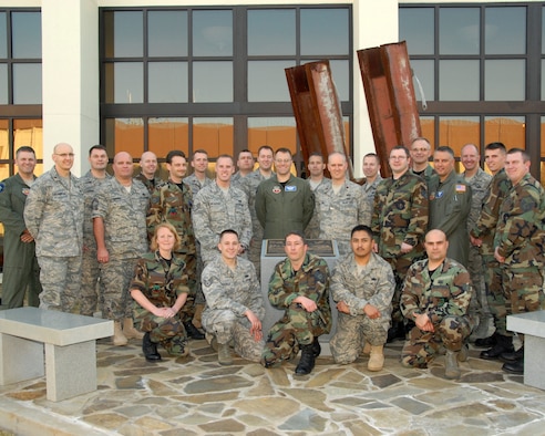 The 101st Information Warfare Flight from the Utah Air National Guard takes a group photo in front of the 601st Air and Space Operations Center at Tyndall Air Force Base, Fla. on March 4, 2009.  The 101st IWF traveled to Tyndall for their annual training to hear mission briefings and tour the AOC.  U.S. Air Force Photo by: Staff Sgt. Emily Monson (RELEASED)