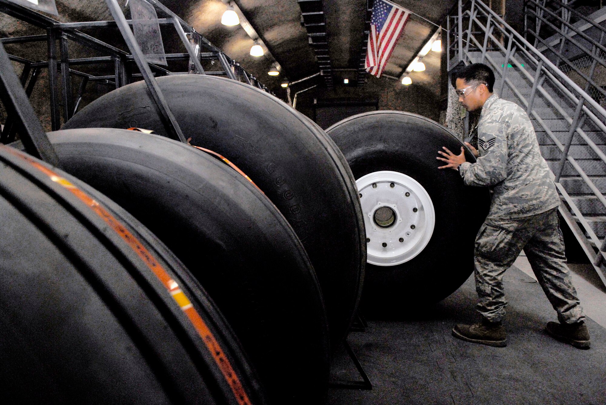 Staff Sgt. Ruben Ramones stores a C-130 Hercules wheel and tire after it passed the assembly inspection April 13 at an air base in Southwest Asia. The base wheel and tire shop supports eight forward operating locations and seven different types of aircraft with a full range of services. Sergeant Ramones is the wheel and tire shift lead for the 379th Expeditionary Maintenance Squadron, and is deployed from Yokota Air Base, Japan.  (U.S. Air Force photo/Senior Airman Andrew Satran)