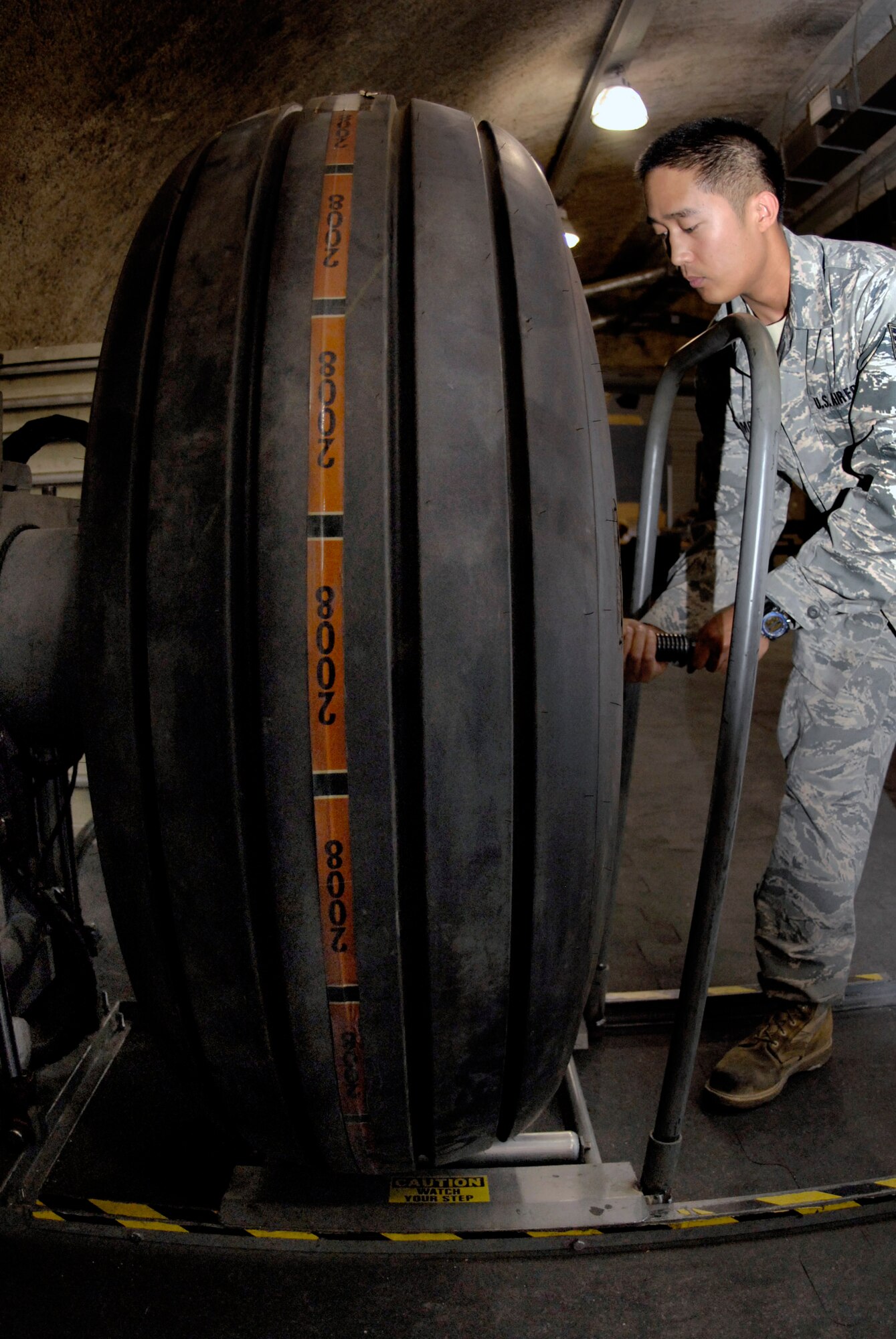 Staff Sgt. Ruben Ramones works on a C-130 Hercules wheel April 13 at an air base in Southwest Asia. The base wheel and tire shop supports eight forward operating locations and seven different types of aircraft with a full range of wheel and tire services. Sergeant Ramones is deployed from Yokota Air Base, Japan in support of Operations Iraqi and Enduring Freedom and Combined Joint Task Force - Horn of Africa. He is the wheel and tire shift lead for the 379th Expeditionary Maintenance Squadron. (U.S. Air Force photo/Senior Airman Andrew Satran)