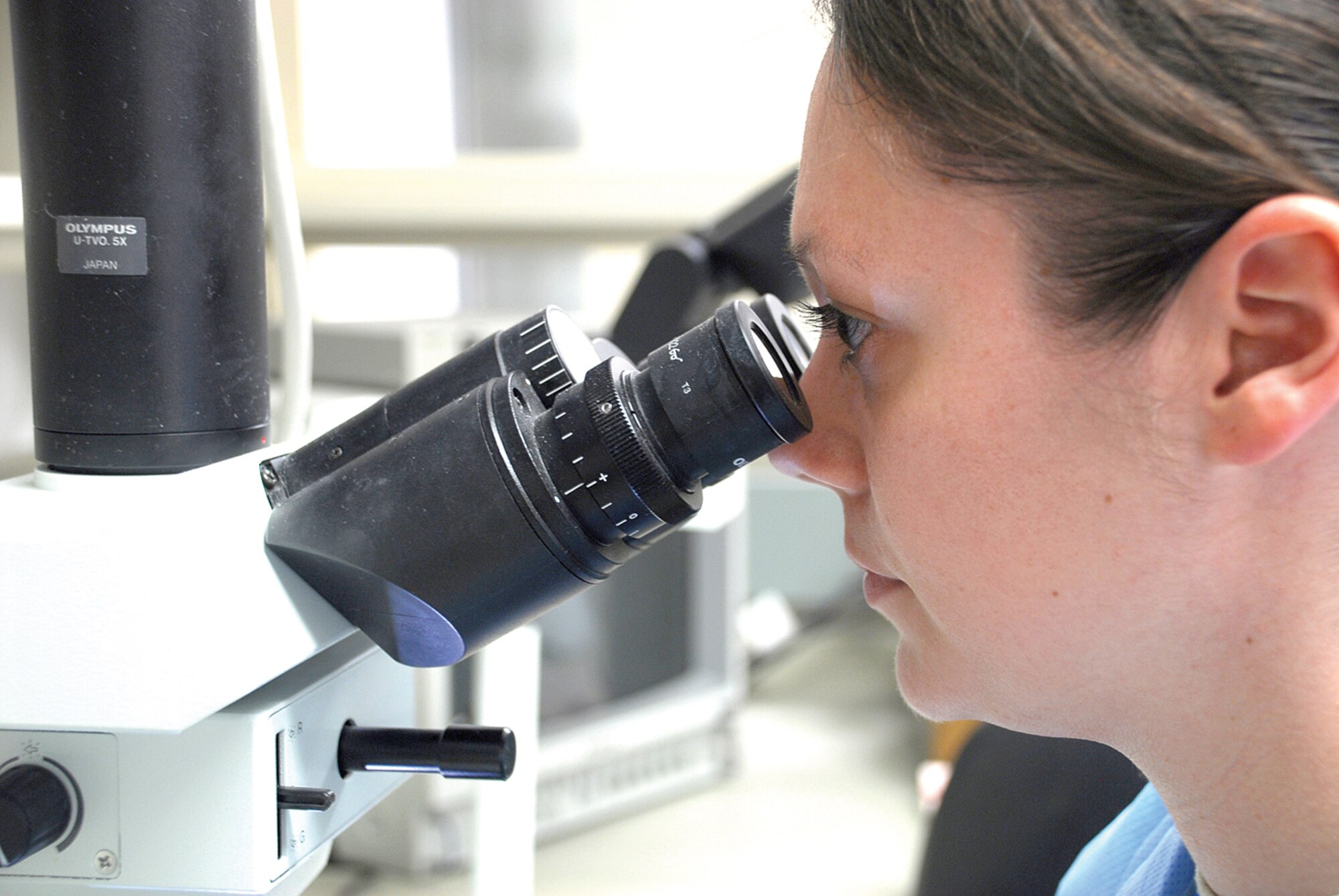 Tech. Sgt. Nicole Dirickson, 56th Medical Support Squadron medical laboratory technician, checks for abnormalities in a patient’s urine April 7 in the urinalysis section of the 56th MDSS laboratory. (U.S. Air Force photo/ Airman 1st Class Traci Forte.)