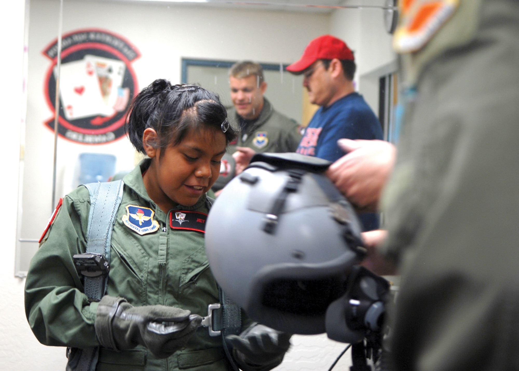 Pilot-for-a-day, Shawnee “Jet” Lee, 13, visits life support during a visit to Luke April 7. Ms. Lee has total kidney failure, but still enjoys being active, participating in basketball, volleyball, softball and track. (U.S. Air Force photo/ Airman 1st Class Ronifel Yasay.)
