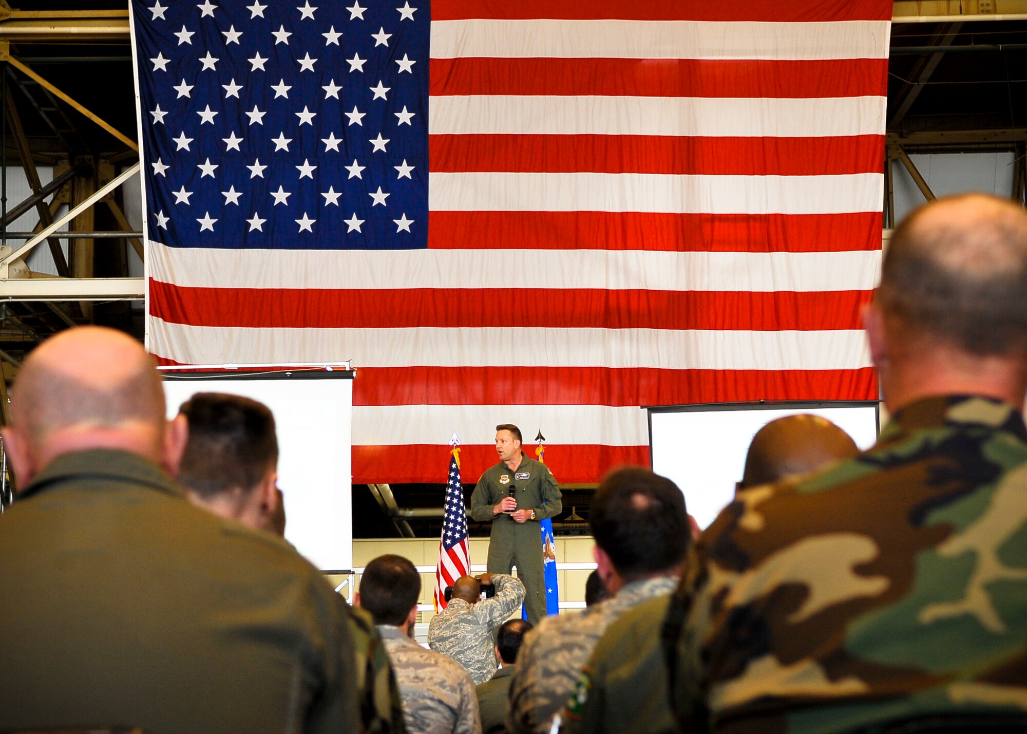 Team Fairchild listens attentively as the team chief for Air Mobility Command’s Inspector General compliments the dedication and work ethic of Airmen from the 92nd Air Refueling Wing April 9. The 92nd and 141st ARWs took part in an operational readiness inspection together in March. (U.S. Air Force photo / Senior Airman Joshua K. Chapman)  