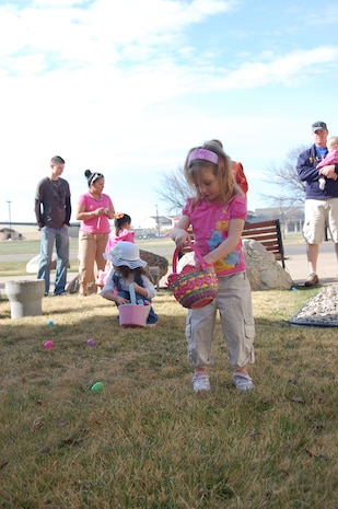 Lorelei, 3, searches for Easter eggs outside the base chapel April 11. More than 30 children searched the chapel grounds for more than 500 plastic eggs filled with candies and Bible verses. The Easter egg hunt is an annual event hosted by the 341st Missile Wing chapel staff. (U.S. Air Force photo/Staff Sgt. Eydie Sakura)