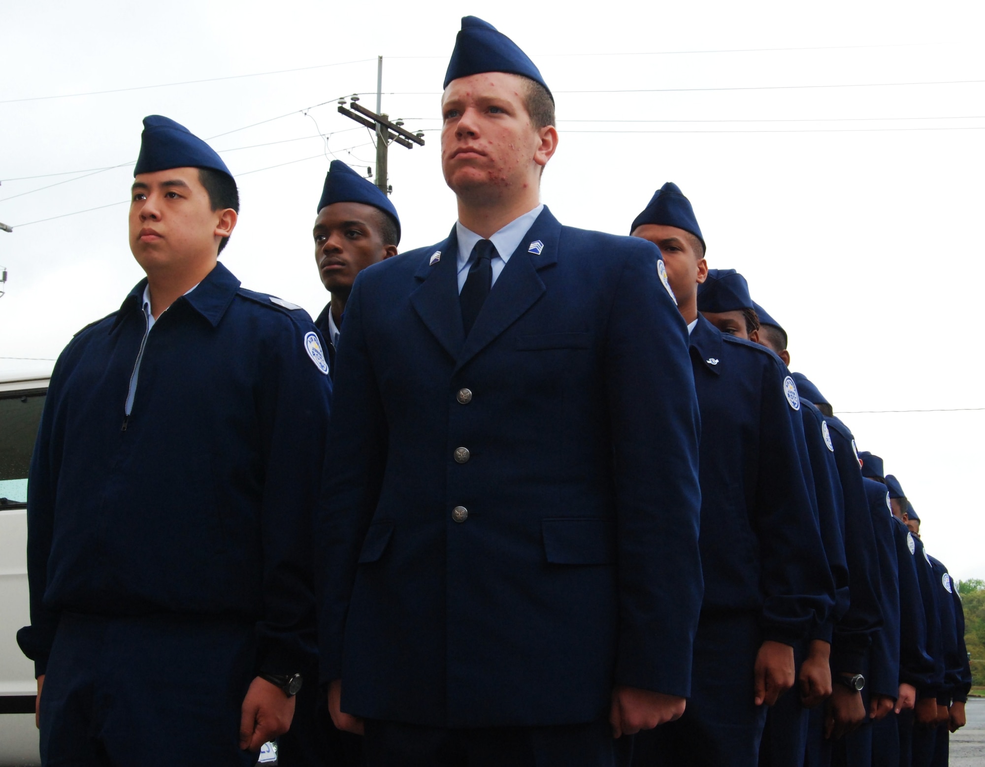 U.S. Air Force JROTC cadets from Tucker High School in Tucker, Ga., stand in a formation as they prepare to receive a safety briefing before their orientation flight April 15. More than 1,000 cadets flew aboard a C-130 aircraft and toured static displays inside a hangar to learn more about U.S. Air Force careers April 14-15. (U.S. Air Force photo/Airman Chelsea Gitzen)