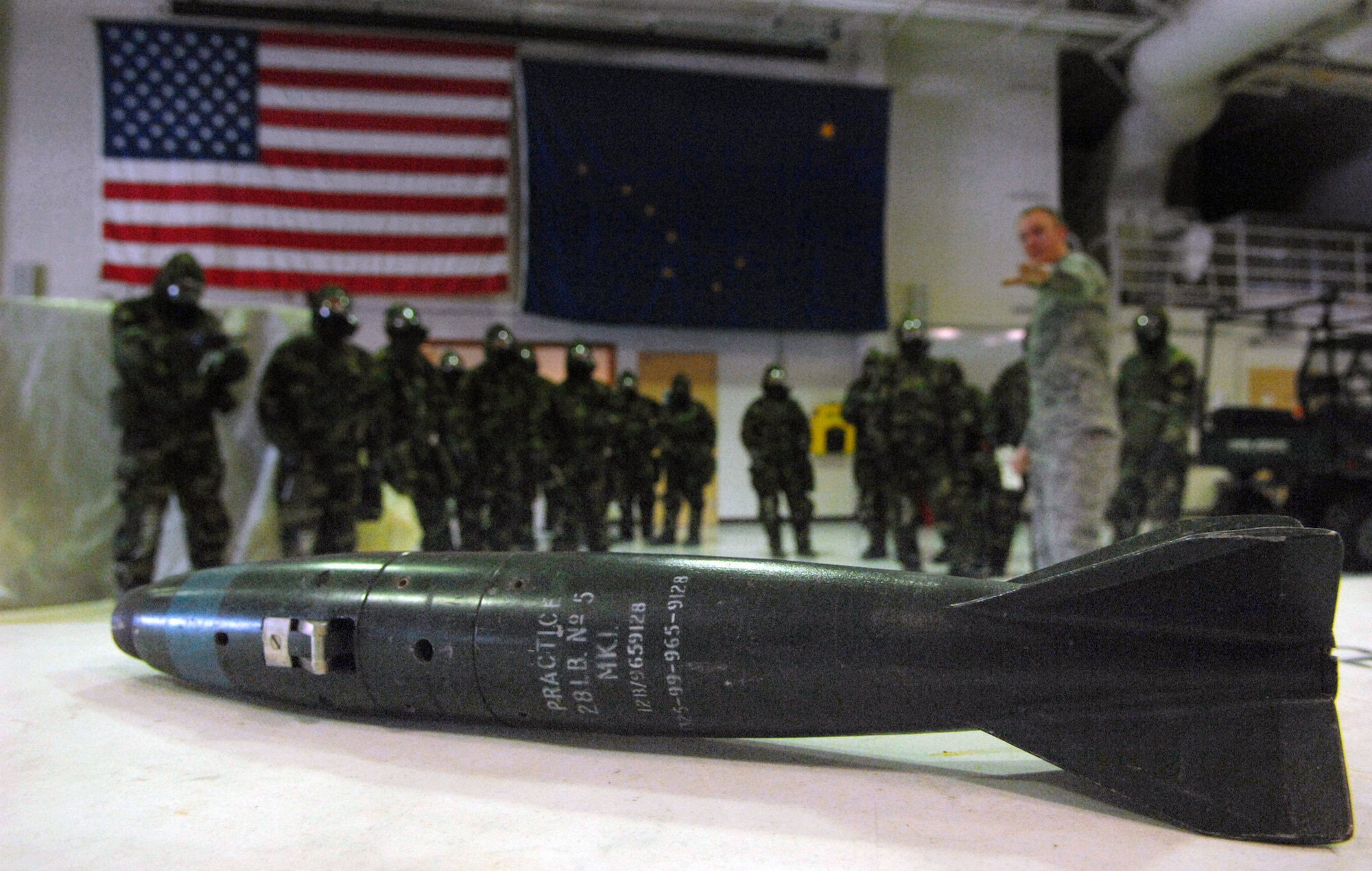 Senior Airman John Buckley reviews different types of explosive ordnance during a chemical warfare training class Apr. 7 at Eielson Air Force Base, Alaska. Airman Buckley is a chemical, biological, radiological, nuclear and high-yield explosives training instructor and responder assigned to the 354th Civil Engineering Squadron. (U.S. Air Force photo/Senior Airman Christopher Boitz)