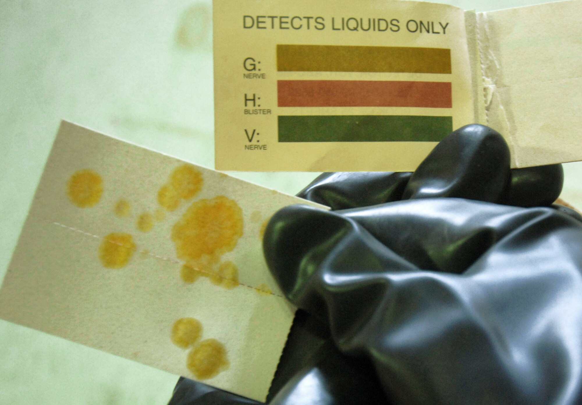 Senior Airman John Buckley demonstrates how to identify chemical agents on a piece of M8 paper Apr. 7. Airman Buckley is a chemical, biological, radiological, nuclear and high-yield explosives training instructor and responder assigned to the 354th Civil Engineering Squadron at Eielson Air Force Base, Alaska. (U.S. Air Force photo/Senior Airman Christopher Boitz)