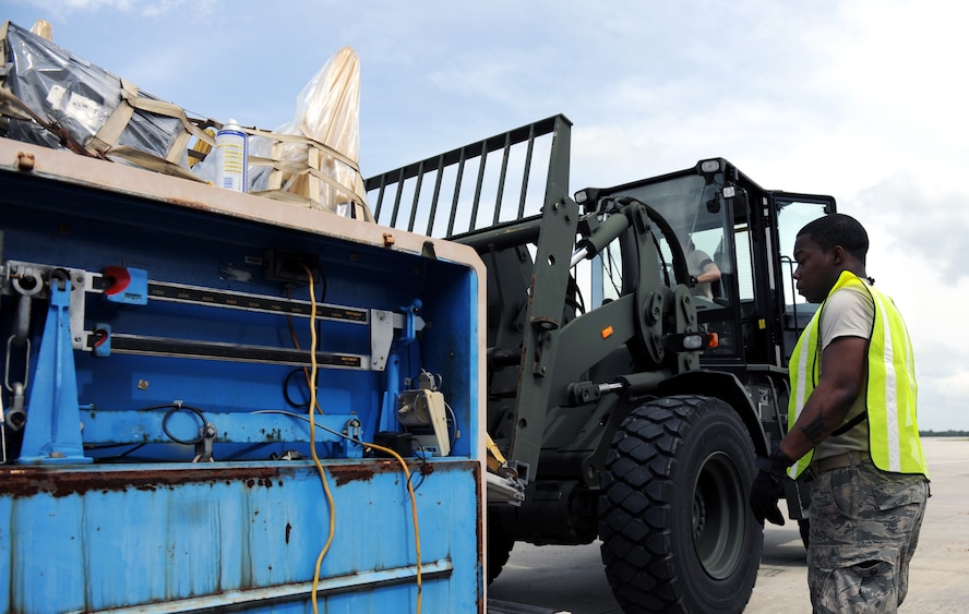 MOODY AIR FORCE BASE, Ga. -- Airman 1st Class Mitchell Sterling, 23rd Logistics Readiness Squadron traffic management office journeyman, weighs a pallet during a Phase I Operational Readiness Exercise here April 14. The dimensions of each pallet are used to determine proper space and weight distribution when loaded onto an aircraft for transportation to a deployed location. (U.S. Air Force photo by Airman Joshua Green) 