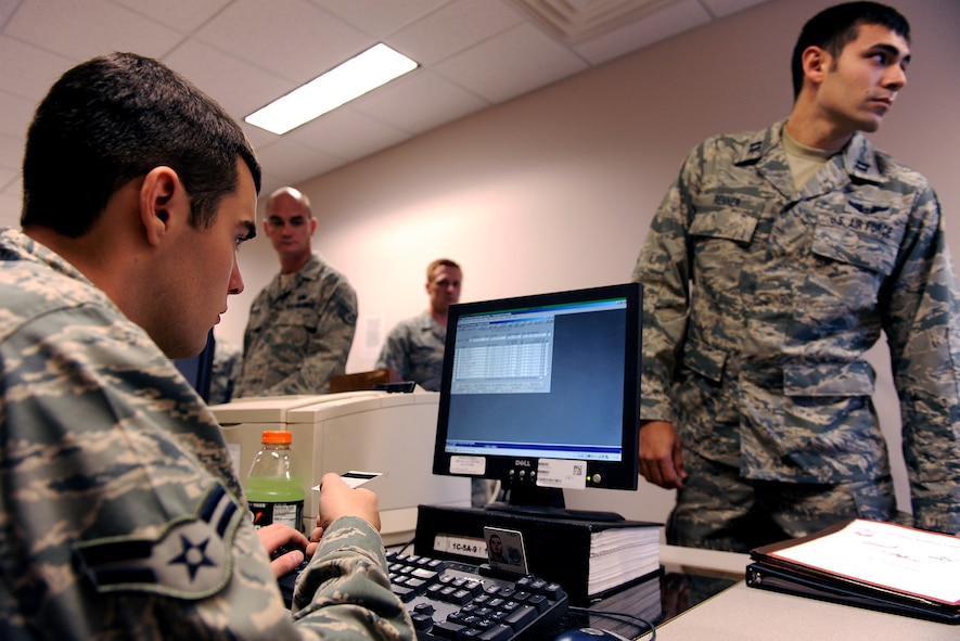 MOODY AIR FORCE BASE, Ga. -- Airman 1st Class Devin Cook, 23rd Logistics Readiness Squadron traffic management office journeyman, adds Capt. James Renner, 71st Rescue Squadron navigator, to a list of boarding passengers during a Phase I Operational Readiness Exercise here April 14. Members tasked to deploy are entered into a manifest program for accountability purposes. (U.S. Air Force photo by Airman Joshua Green) 
