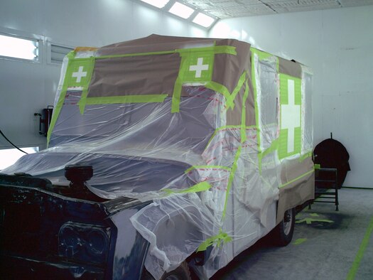 A 1963 Dodge Power-Wagon response ambulance from the Malmstrom Museum is prepped for application of red paint in the paint booth at the 341st Logistics Readiness Squadron allied trades shop. The allied trades shop repainted the ambulance "Strato Blue" and the vehicle was placed back on display April 10. (Courtesy photo)
