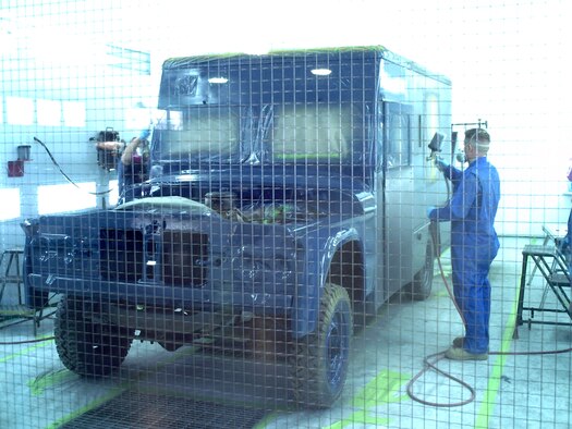 Duane Bolender, 341st Logistics Readiness Squadron mobile equipment metal mechanic, and Tech. Sgt. Shane Jackson, 341st LRS assistant NCO in charge of allied trades, shoot a coat of "Strato Blue" base coat on a 1963 Dodge Power-Wagon ambulance April 9 in the allied trades paint booth. The ambulance was brought back to the Malmstrom Museum April 10, where it has been on display since 1985. (Courtesy photo)