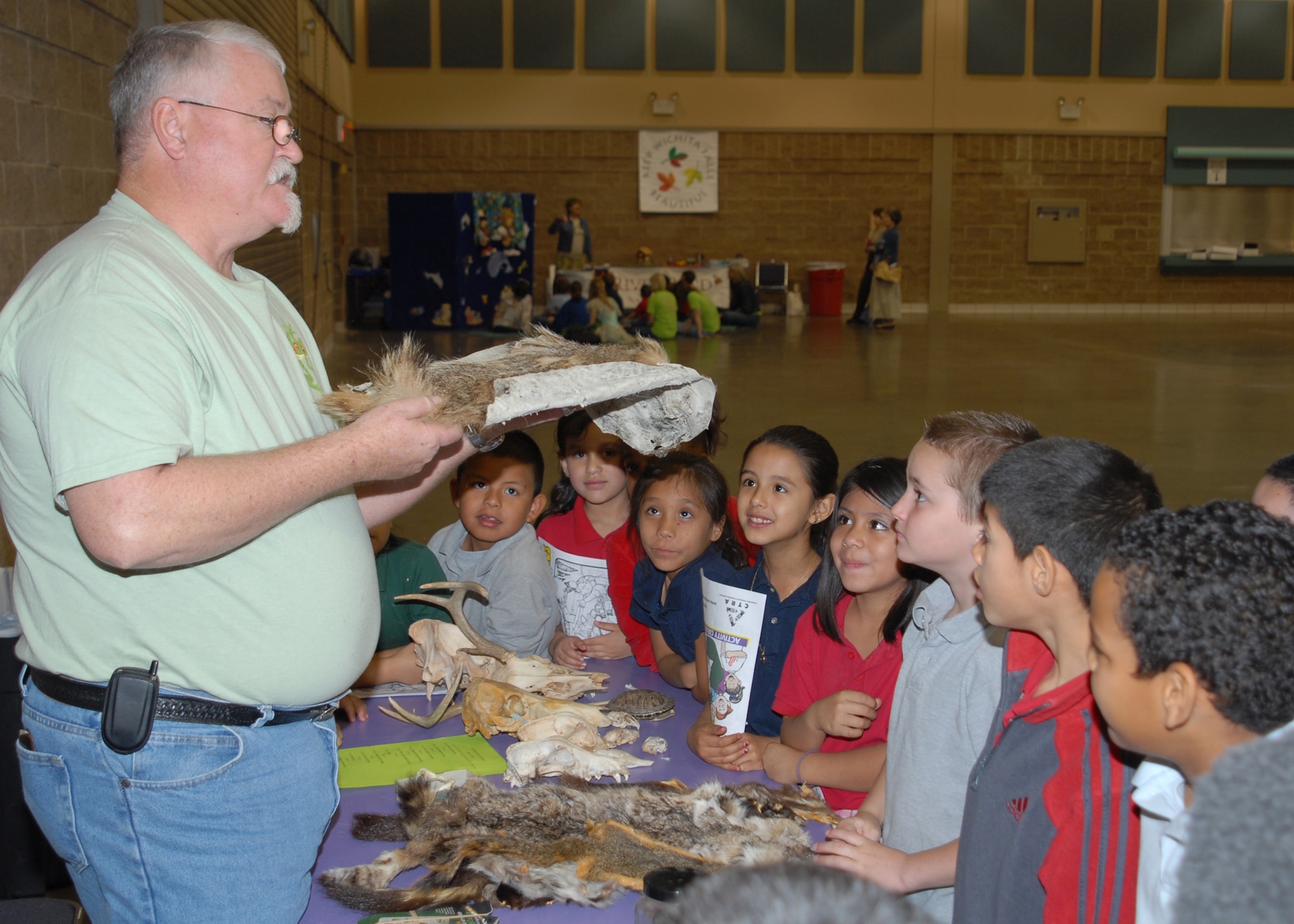Timothy Hunter, a base agronomist of the 82nd Civil Engineering Squadron speak to children from a mixture of local schools in observance of Earth Day April 14 at the Multi-Purpose Event Center in Wichita Falls, Texas.  The collection of insects, spiders, tarantulas, scorpions, centipedes, wasp nests, moths, butterflies and brown recluses come from Mr. Hunter’s personal collection. The collections spans a 30-year passion of finding the best “critters” in nature. (U.S. Air Force photo/Lou Anne Sledge)