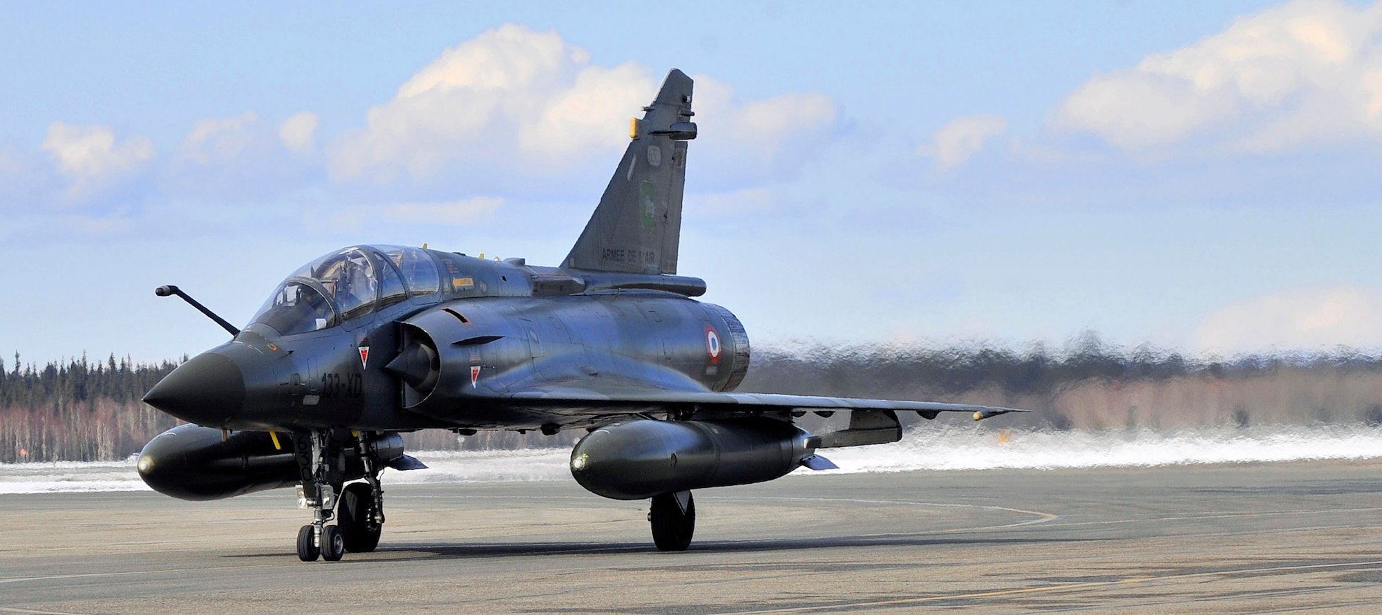 A Mirage 2000 fighter from Luxeuil Air Base, France, taxis to a parking spot April 14 at Eielson Air Force Base, Alaska. Realistic combat training, such as that during a Red Flag-Alaska exercise, is vital to the success of air and space operations. (U.S. Air Force photo/Airman 1st Class Willard E. Grande II)