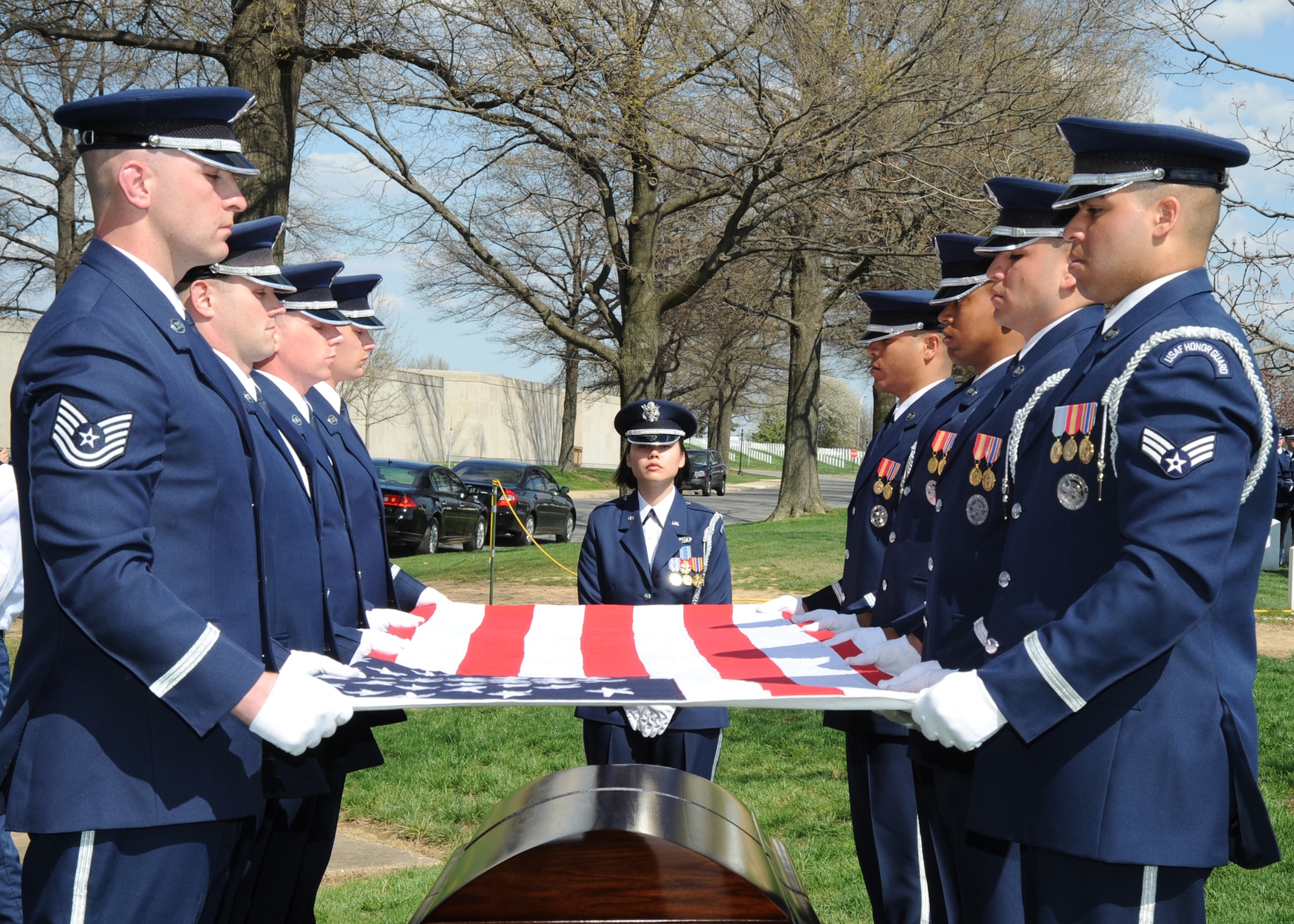 ARLINGTON NATIONAL CEMETERY, Va. – U. S. Air Force Honor Guard members fold a flag that will be handed to the wife of Col. Michael Krueger, former 22nd Air Refueling Wing vice commander, April 9.  The interment for Colonel Krueger included full military honors that included body bearers, a twenty-one gun salute, a band and a caisson. (Photo by Airman 1st Maria Class Ruiz)