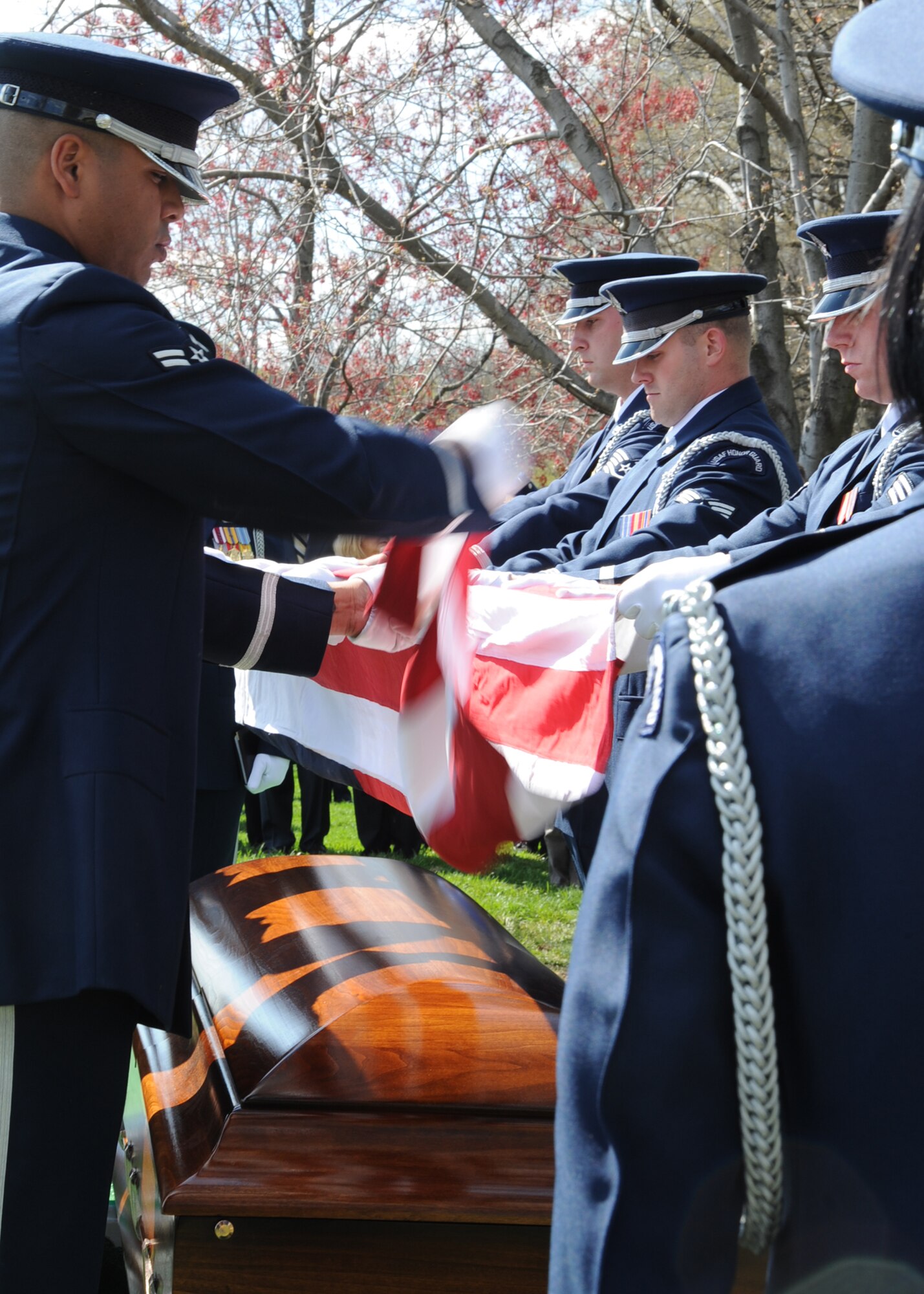 ARLINGTON NATIONAL CEMETERY, Va. -- The U. S. Honor Guard members from Arlington National Cemetery fold the flag that was handed to Lisa Krueger, wife of  Col. Michael Krueger, former 22nd Air Refueling Wing vice commander. The tradition honors those who have passed and those who remain to feel that loss. (Photo by Airman 1st Class Maria Ruiz)