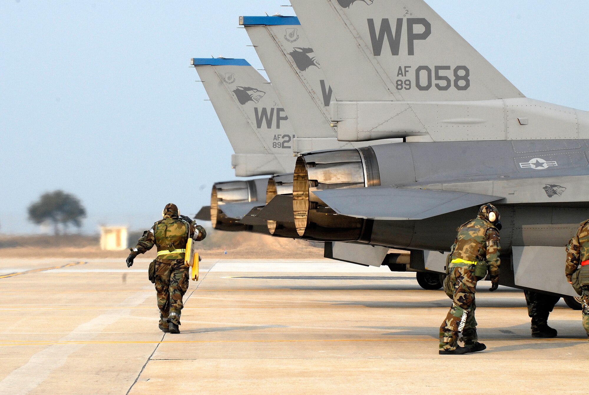 F-16 Fighting Falcons from Kunsan Air Base, Republic of Korea, like those shown here, departed recently for Eielson Air Force Base, Alaska, to participate in Red Flag-Alaska.  (U.S. Air Force photo/Staff Sgt. Jason Colbert)
