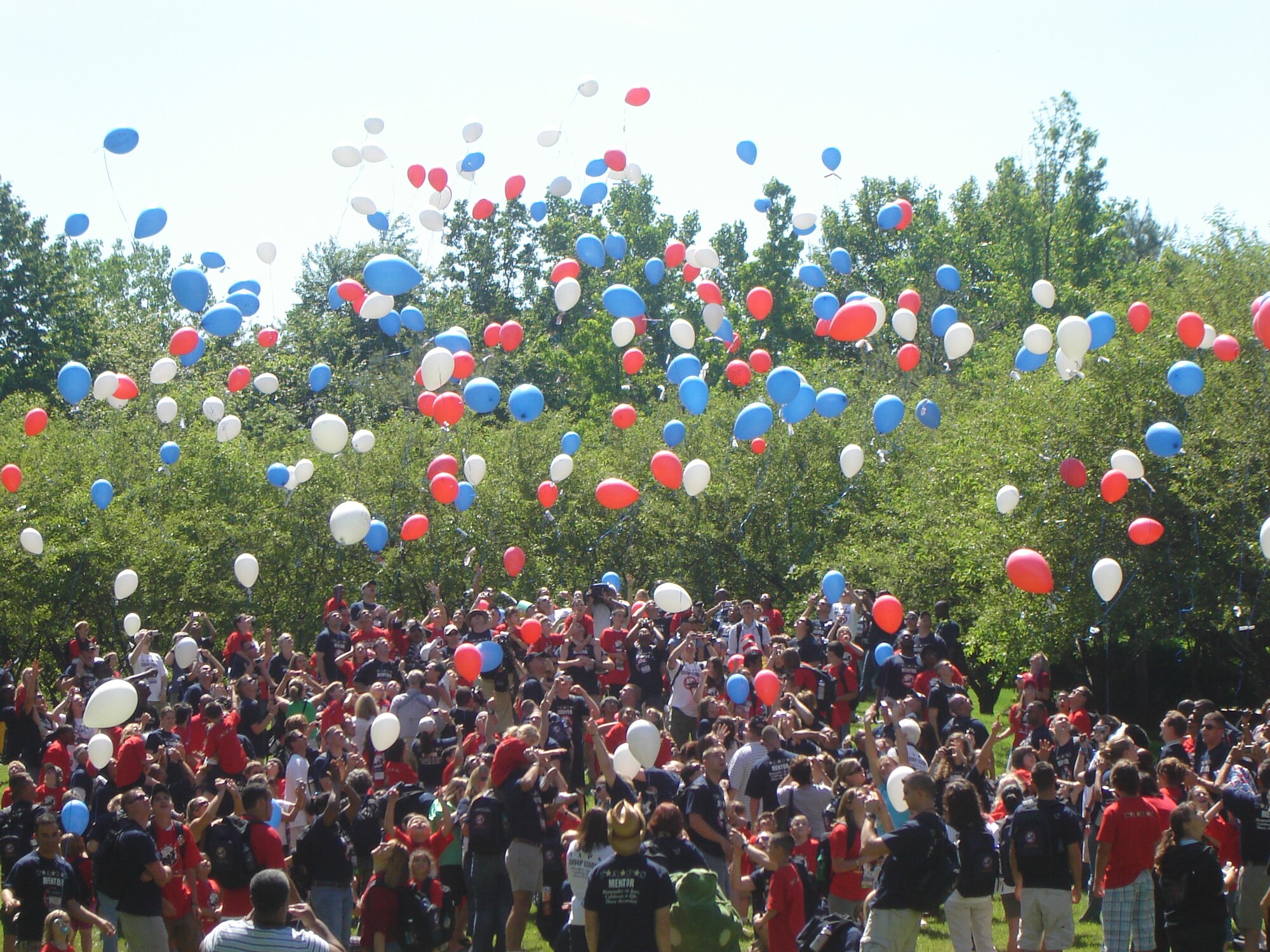 TAPS Good Grief Camp participants release balloons into the air at a D.C. park with letters written to loved ones who have died while serving in the military. TAPS brings together children of all ages who have lost a loved one serving in the armed forces and pairs them with mentors who are currently serving in the military. Children are welcome to participate in the program regardless of the geography, circumstances or relationship to the deceased. (Courtesy photo)