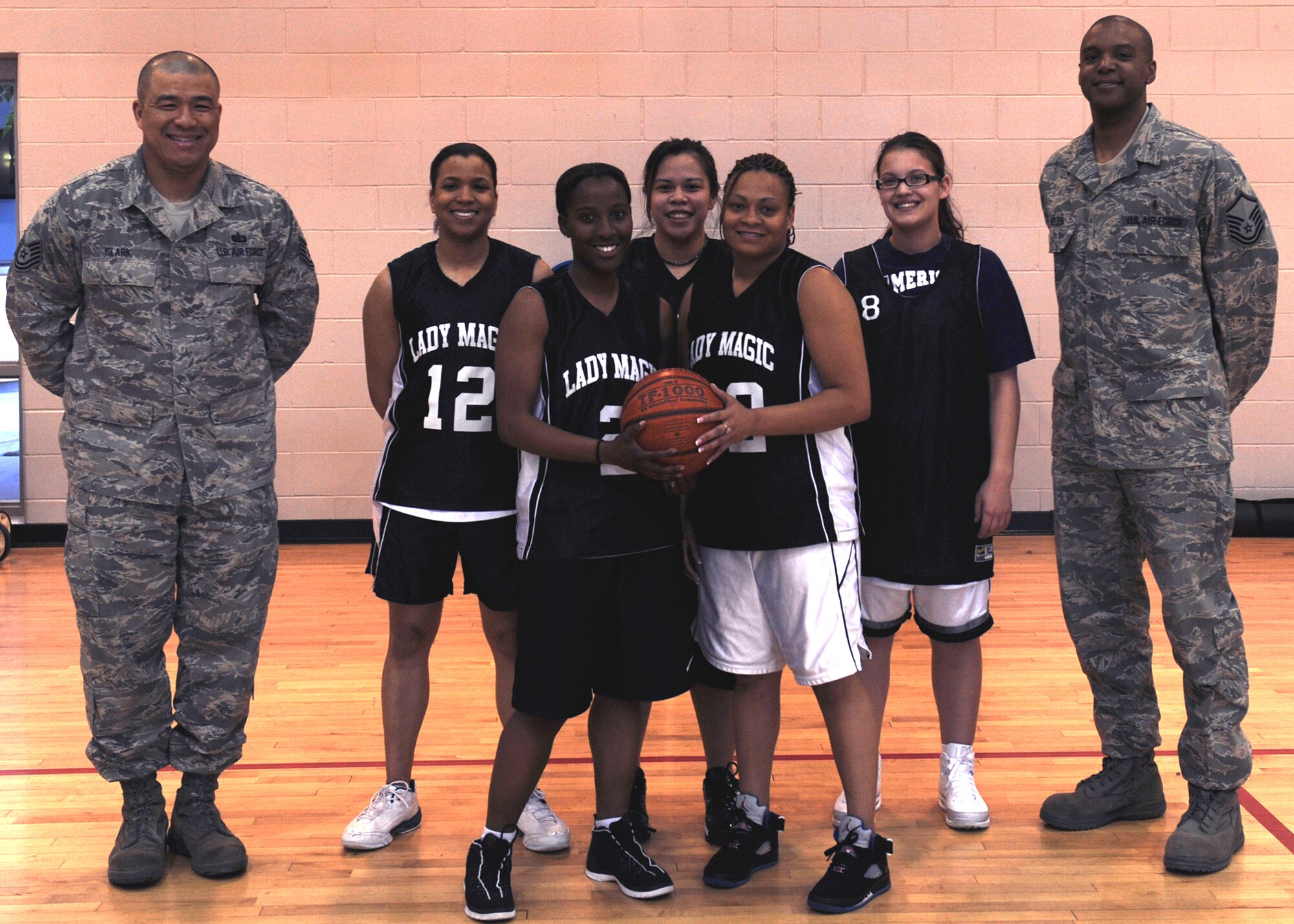 MINOT AIR FORCE BASE, N.D. -- Members of the base women's basketball team pose for a picture at the McAdoo Sports and Fitness Center here April 15. The Lady Magic recently captured first place in the Minot Recreation City League after finishing the season with a record of 12-3. (U.S. Air Force photo by Senior Airman Sharida Jackson)
