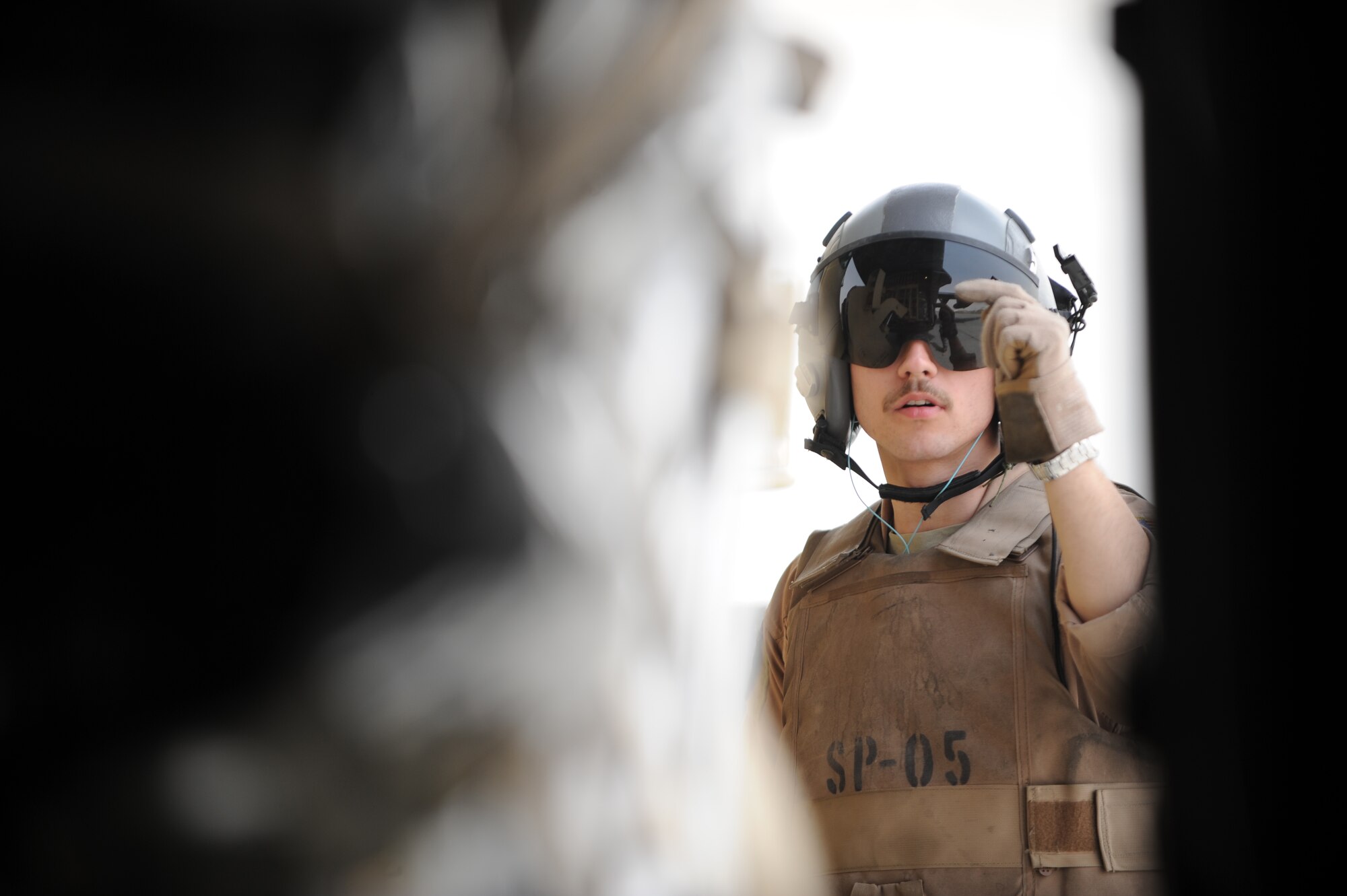 U.S. Air Force C-130 Hercules Loadmaster Airman 1st Class Benjamin Shest, assigned to the 777th Expeditionary Airlift Squadron, Joint Base Balad, Iraq, directs cargo during airlift operations April 8, 2009, in support of Operation Iraqi Freedom.  (U.S. Air Force photo by Staff Sgt. James L. Harper Jr.)