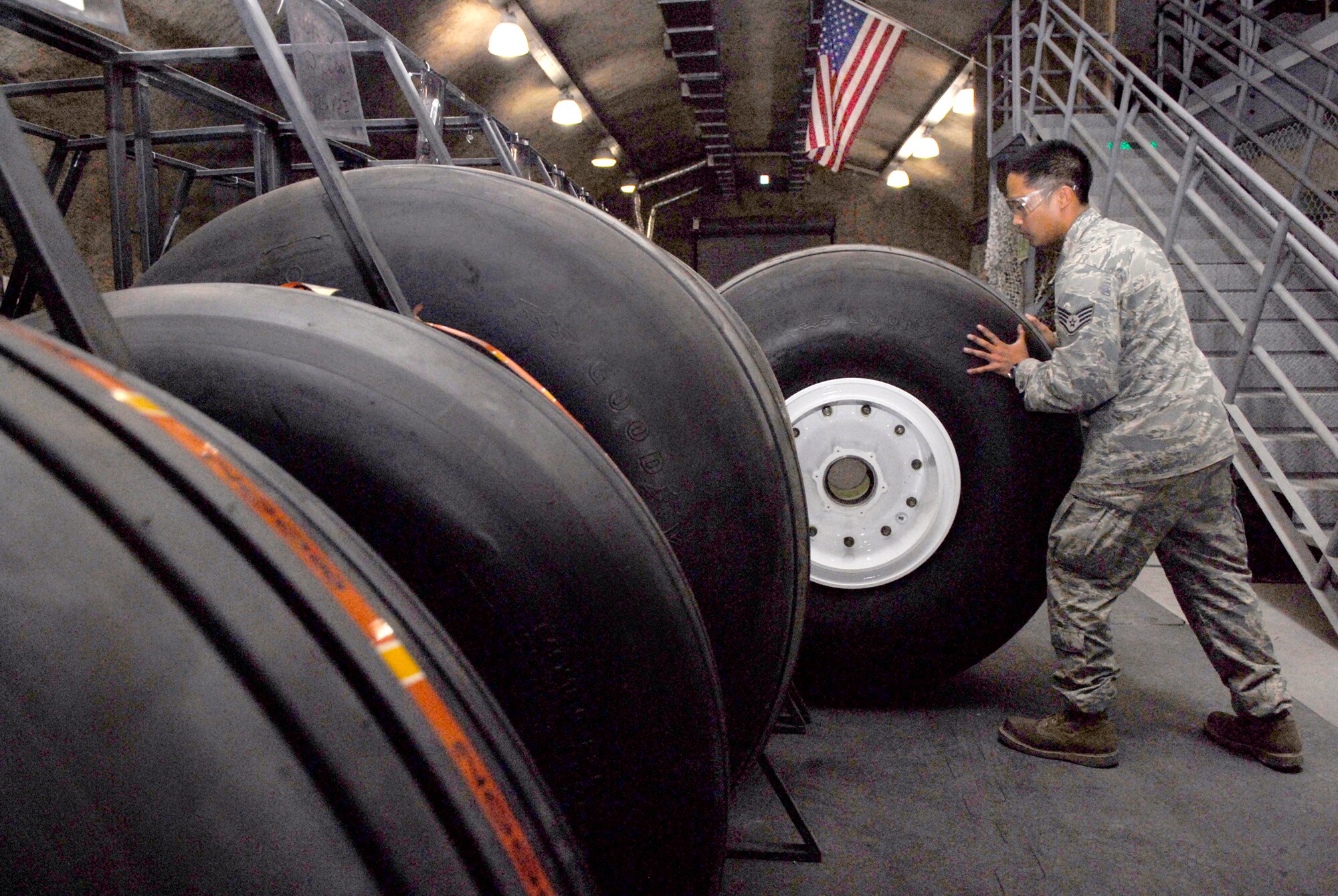 Staff Sgt. Ruben Ramones, 379th Expeditionary Maintenance Squadron wheel and tire shift lead, stores a C-130 wheel and tire after it passed the assembly inspection, Apr. 13, 2009, at an undisclosed location in Southwest Asia.  The base Wheel and Tire shop supports eight forward operating locations and seven different types of aircraft with a full range of wheel and tire services.  Sergeant Ramones hails from Sacramento, Calif. and is deployed from Yokota Air Base, Japan in support of Operations Iraqi and Enduring Freedom and Combined Joint Task Force - Horn of Africa.  (U.S. Air Force photo/Senior Airman Andrew Satran/released)    