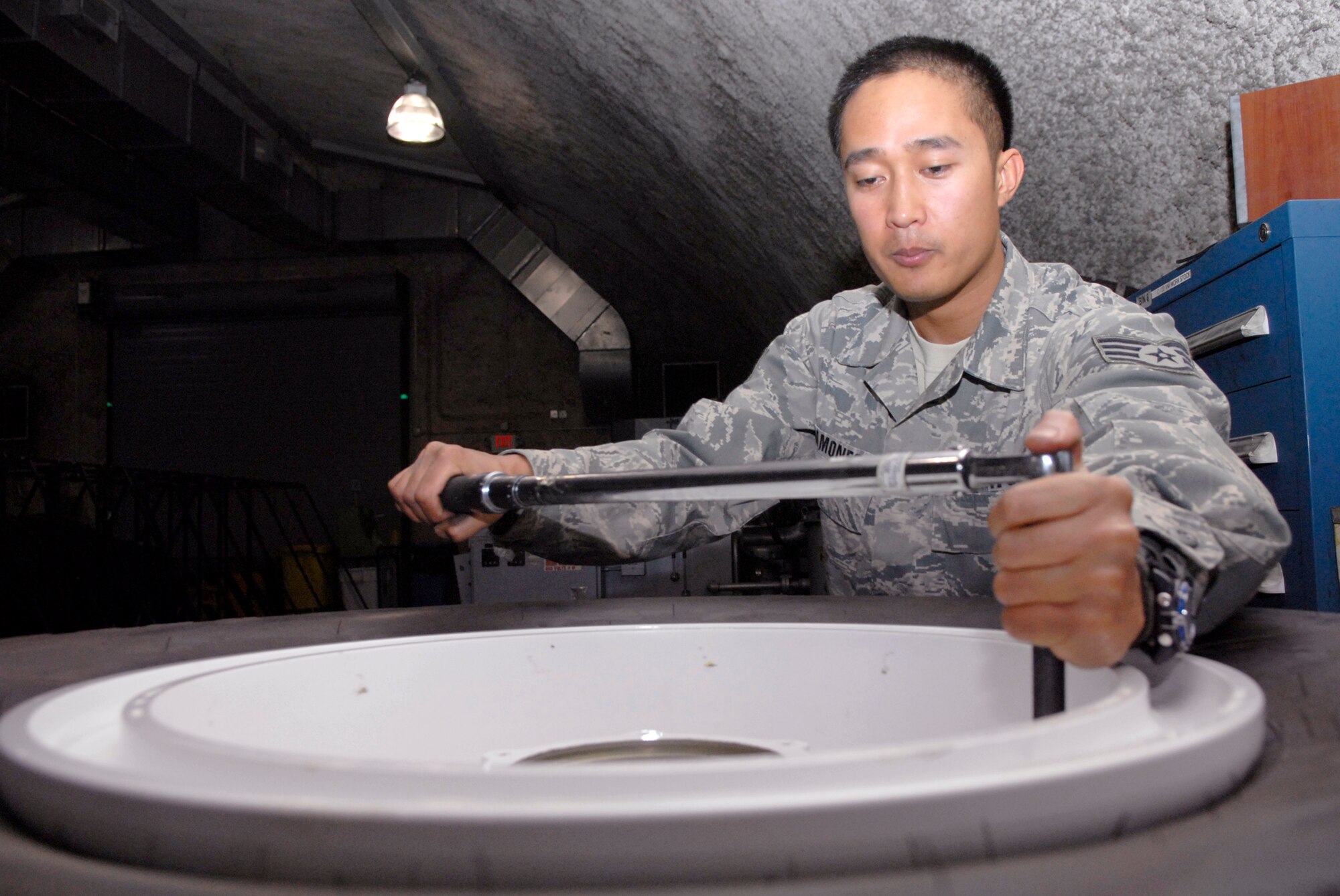 Staff Sgt. Ruben Ramones, 379th Expeditionary Maintenance Squadron wheel and tire shift lead, tightens bolts on a C-130 wheel with a torque wrench, Apr. 13, 2009, at an undisclosed location in Southwest Asia.  The base Wheel and Tire shop supports eight forward operating locations and seven different types of aircraft with a full range of wheel and tire services.  Sergeant Ramones hails from Sacramento, Calif. and is deployed from Yokota Air Base, Japan in support of Operations Iraqi and Enduring Freedom and Combined Joint Task Force - Horn of Africa.  (U.S. Air Force photo/Senior Airman Andrew Satran/released)    