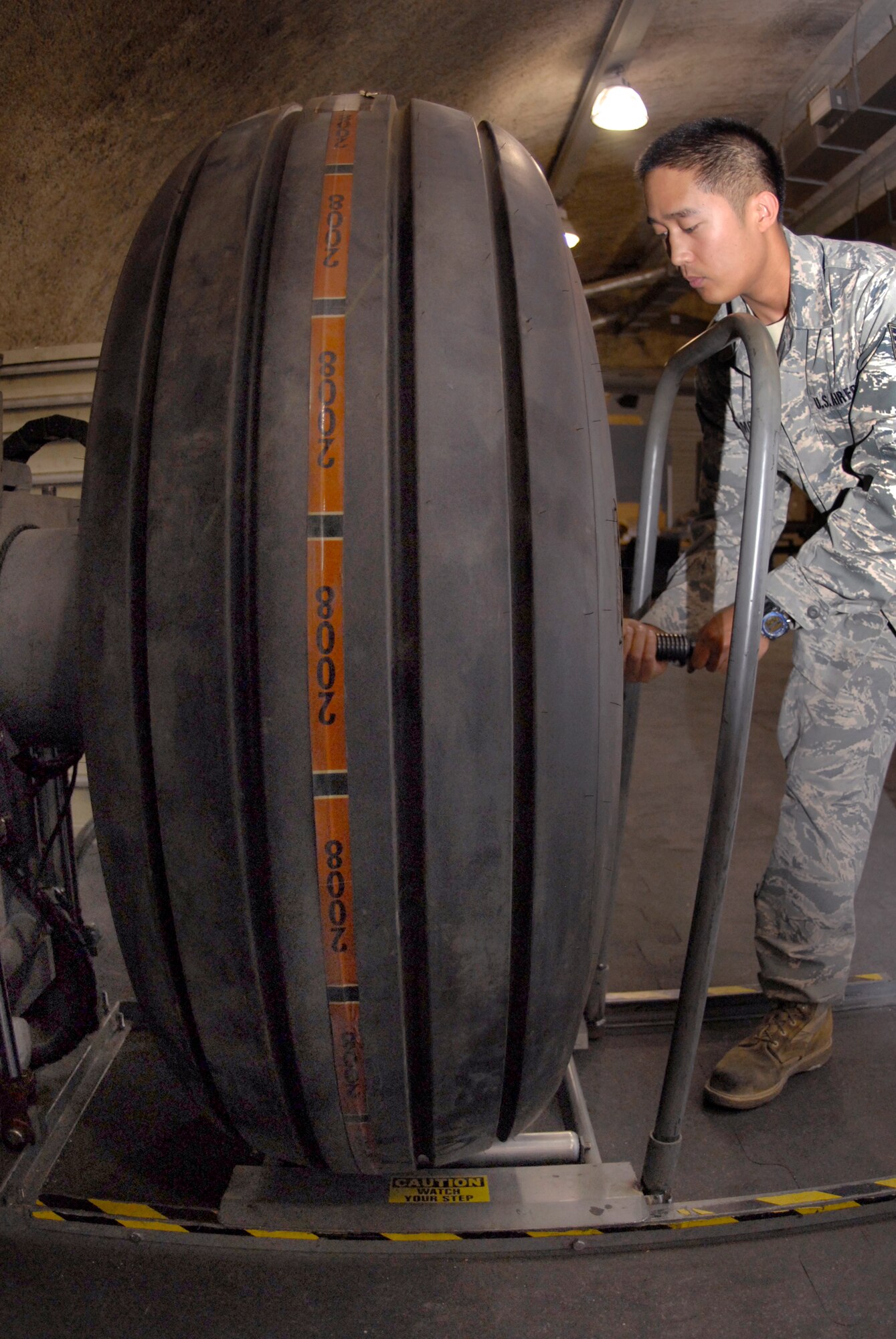 Staff Sgt. Ruben Ramones, 379th Expeditionary Maintenance Squadron wheel and tire shift lead, tightens bolts on a C-130 wheel with a torque wrench, Apr. 13, 2009, at an undisclosed location in Southwest Asia.  The base Wheel and Tire shop supports eight forward operating locations and seven different types of aircraft with a full range of wheel and tire services.  Sergeant Ramones hails from Sacramento, Calif. and is deployed from Yokota Air Base, Japan in support of Operations Iraqi and Enduring Freedom and Combined Joint Task Force - Horn of Africa.  (U.S. Air Force photo/Senior Airman Andrew Satran/released)    