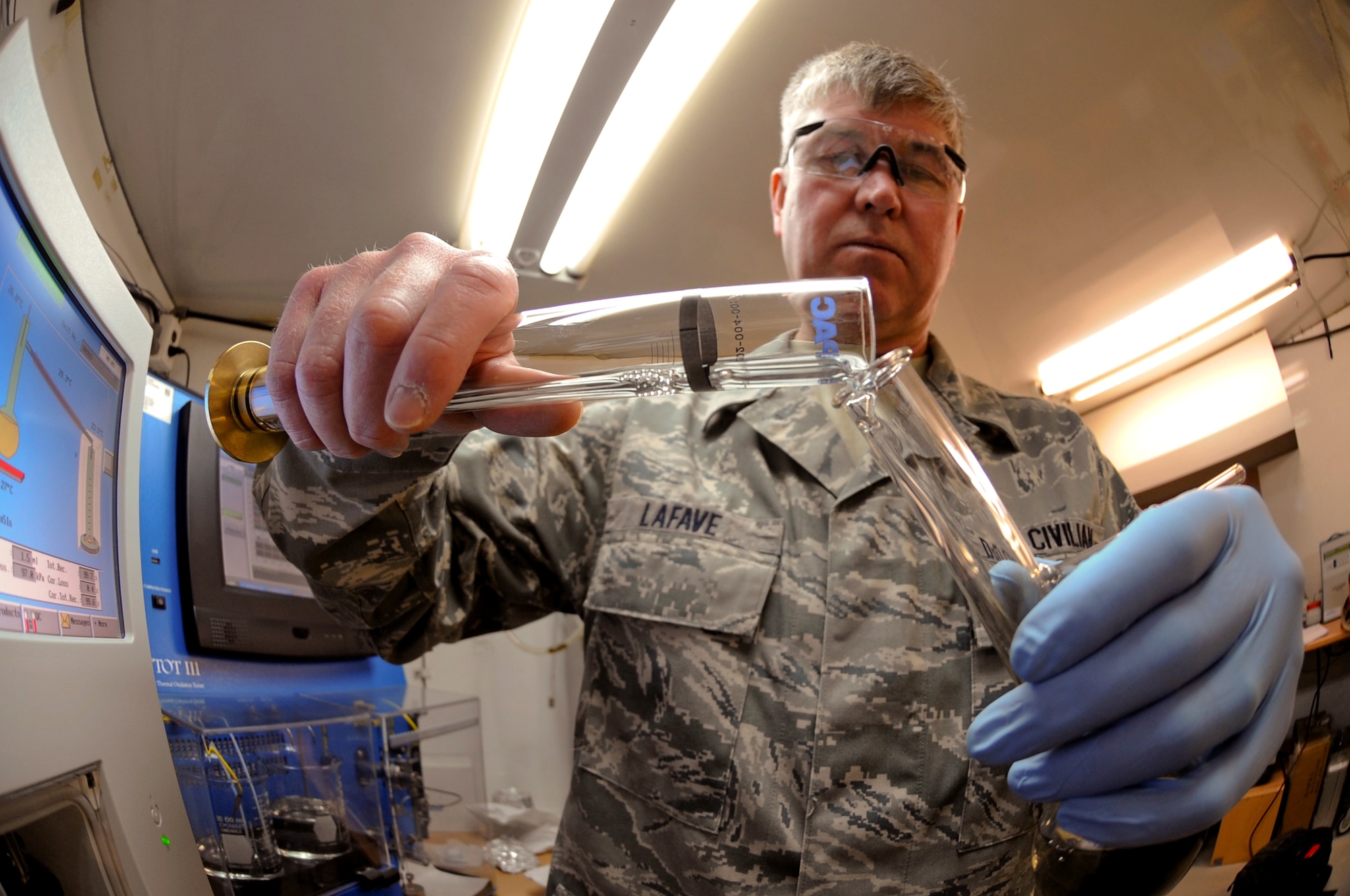 James Lafave, a civilian quality assurance specialist with the 379th Expeditionary Logistic Readiness Squadron, preps diesel fuel from Djibouti, Africa for a distillation test, April 14, 2009, in an undisclosed location in Southwest Asia.  The test will allow Mr. Lafave to determine the quality and characteristics of the fuel.  Mr. Lafave is native to Helena, Mont. and is deployed from Wright-Patterson Air Force Base, Ohio, in support of Operations Iraqi and Enduring Freedom and Combined Joint Task Force - Horn of Africa.  (U.S. Air Force Photo by Staff Sgt. Joshua Garcia/released)