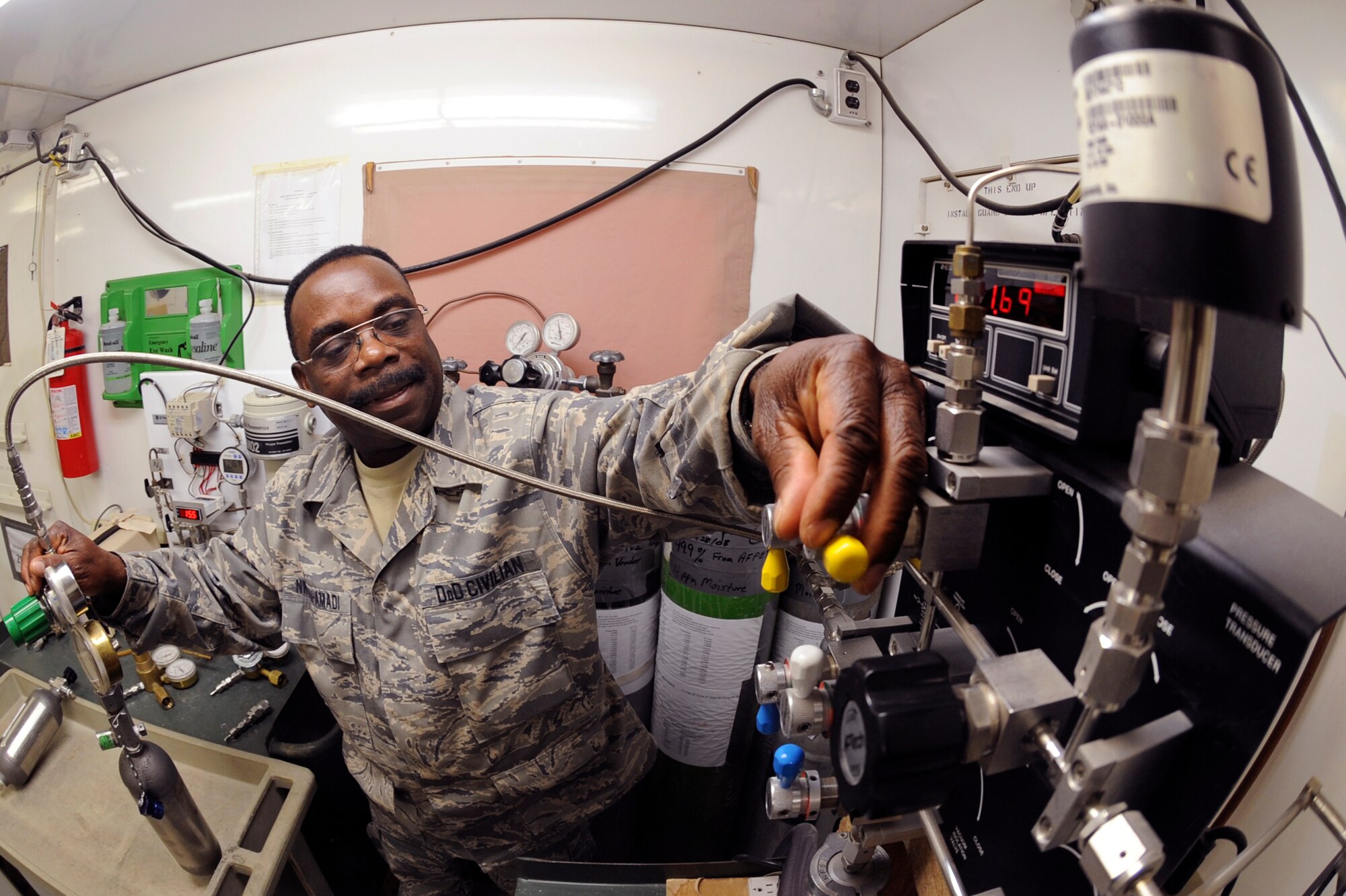 Kasie Nwaohu-Amadi, a chemist with the 379th Expeditionary Logistic Readiness Squadron, preps an oxygen sample for testing, April 14, 2009, in an undisclosed location in Southwest Asia.  The sample will run through multiple tests to ensure the oxygen is within Air Force standards.  Mr. Nwaohu-Amadi is native to Dayton, Ohio and is deployed from Wright-Patterson Air Force Base, Ohio, in support of Operations Iraqi and Enduring Freedom and Combined Joint Task Force - Horn of Africa.  (U.S. Air Force Photo by Staff Sgt. Joshua Garcia/released)