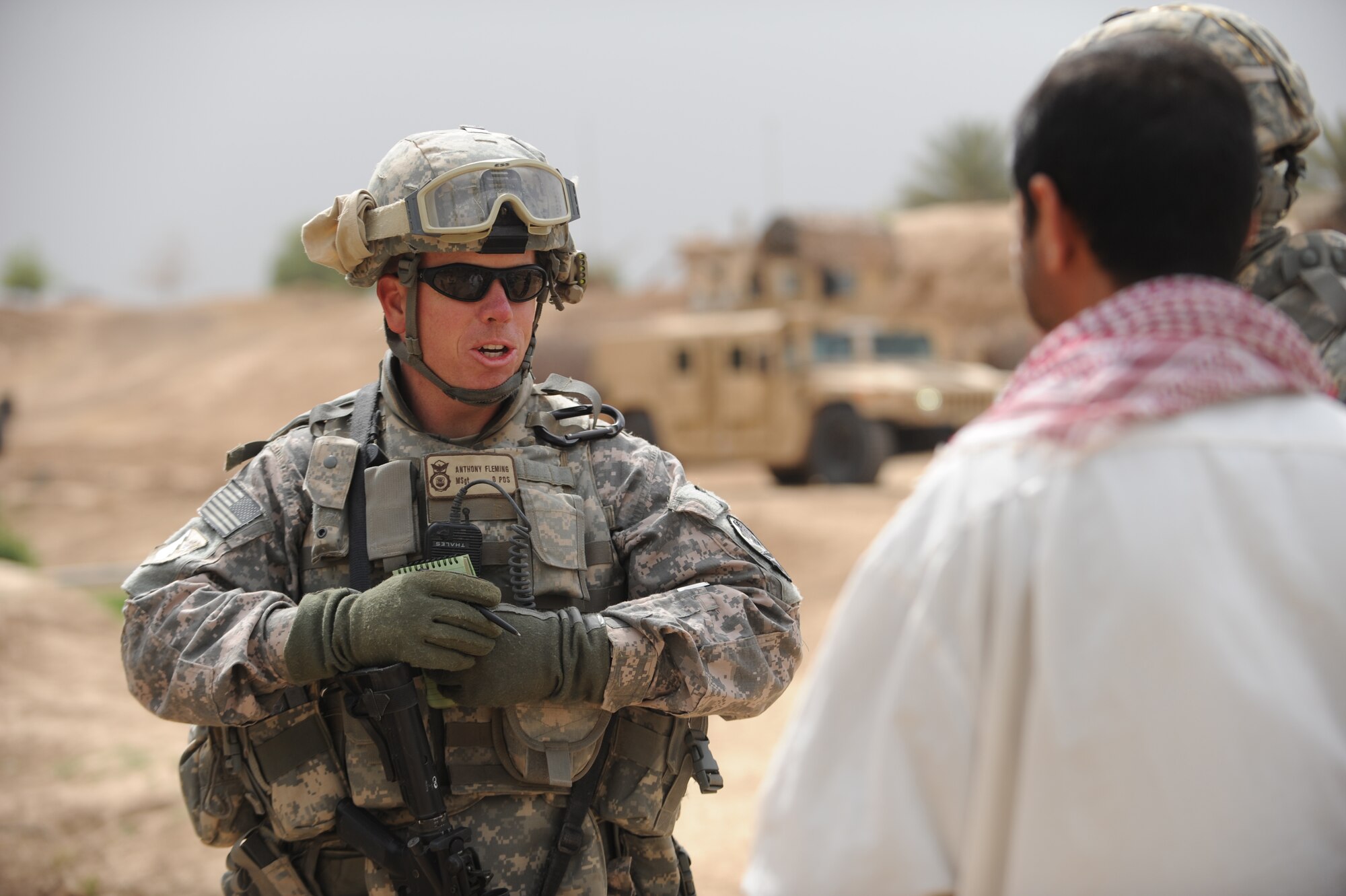 U.S. Air Force Master Sgt. Anthony Fleming, 532nd Expeditionary Security Forces Squadron, Joint Base Balad, Iraq, conducts an interview with and Iraqi villager from Bakr April 9, 2009, in support of Operation Iraqi Freedom.  (U.S. Air Force photo by Staff Sgt. James L. Harper Jr.)