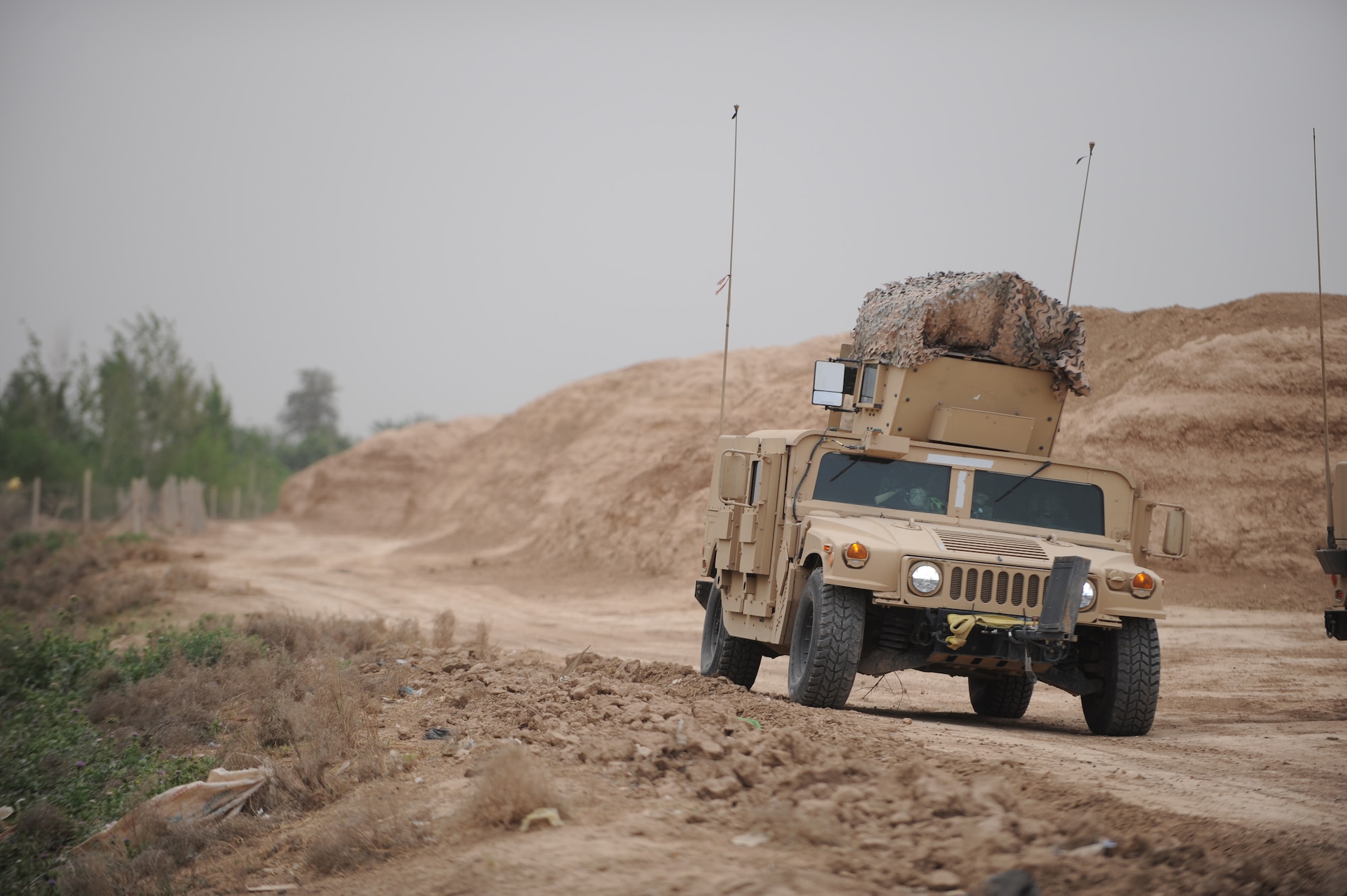 A Humvee from the 532nd Expeditionary Security Forces Squadron conducts security during a patrol in the Iraqi village of Bakr April 9, 2009, in support of Operation Iraqi Freedom.  (U.S. Air Force photo by Staff Sgt. James L. Harper Jr.)