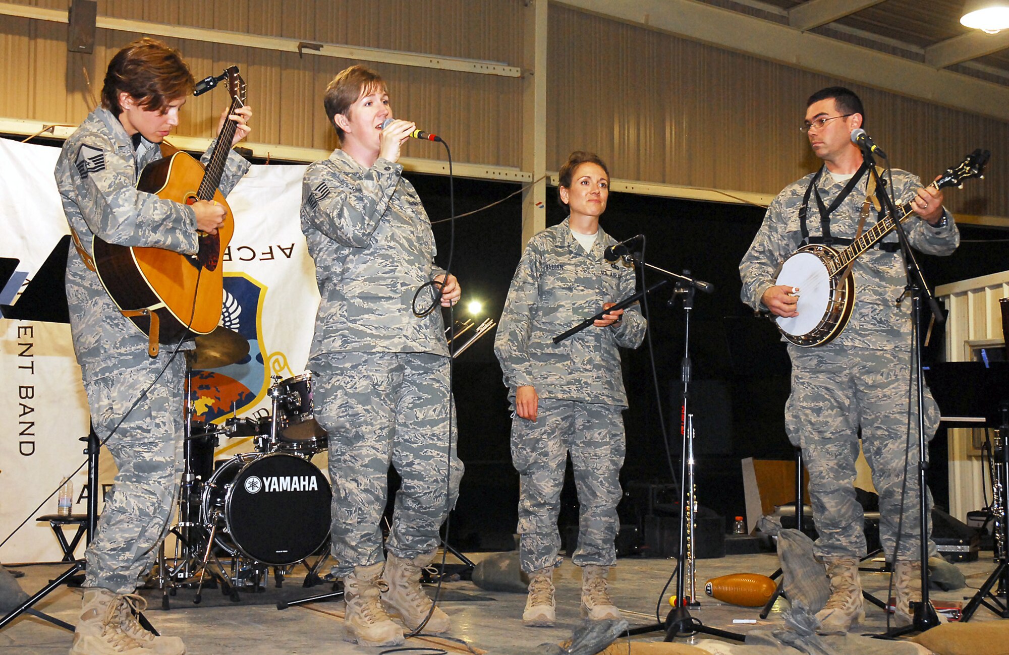 SOUTHWEST ASIA -- Members of the U.S. Air Forces Central Band, Mirage, perform for members of the 386th Air Expeditionary Wing April 11.  The AFCENT Band rotates several ensembles through the AFCENT area of responsibility that performs a wide variety of musical styles to appeal to audiences of all ages and backgrounds. (U.S. Air Force photo by Capt. Angelic Dolan)