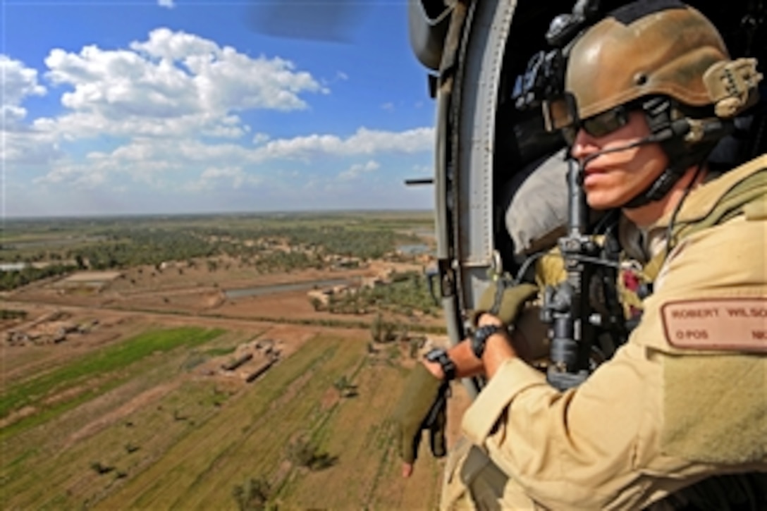 U.S. Air Force Capt. Robert Wilson scans the area for threats during a proficiency exercise on Joint Base Balad, Iraq, April 10, 2009. Wilson is a combat rescue officer assigned to the 64th Expeditionary Rescue Squadron.