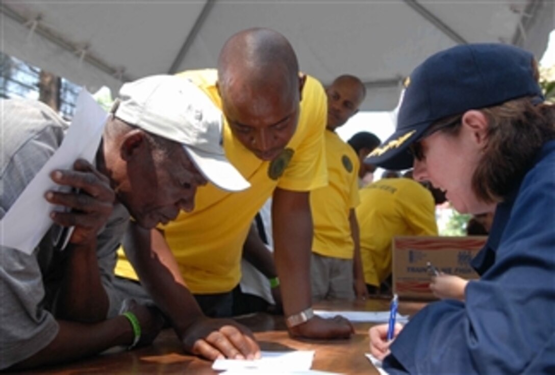 Haitian patients fill out medical history forms for the staff embarked aboard the U.S. Navy Military Sealift Command hospital ship USNS Comfort (T-AH 20) in Killick, Haiti, on April 10, 2009.  The medical community service project is titled Continuing Promise 2009 and is an equal partnership humanitarian and civic assistance mission between the United States and international partners.  It provides support programs afloat and ashore in seven countries in Latin America and the Caribbean.  