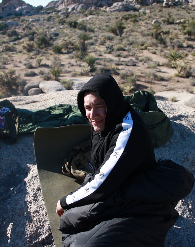 Lance Cpl. Aaron Kristopik, a paralegal clerk with the Combat Center’s Staff Judge Advocate and a native of New Britain, Conn., rises to greet the sun in the Mojave National Preserve on the morning of April 19.