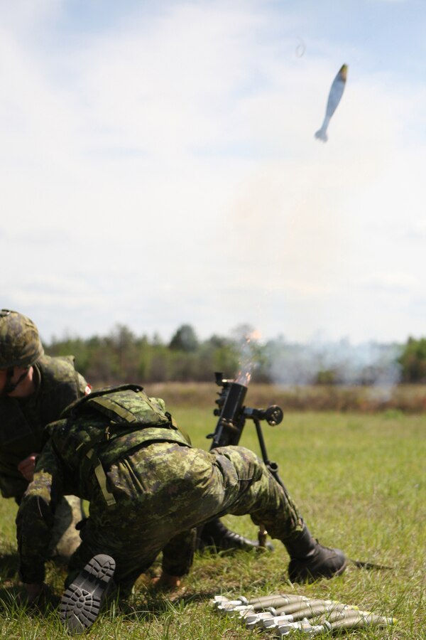 Canadian Royal Army soldiers from Alpha Company, 3d Battalion, 22d Regiment, fire the M224 60mm Lightweight Mortar during Partnership of the Americas 2009.  During POA, U.S. Marines deployed as Special Purpose Marine Air Ground Task Force 24 (SPMAGTF 24), comprised of Marines from the II Marine Expeditionary Force, Marine Medium Helicopter Squadron 764 (HMM-764), 4th Marine Logistics Group and the 24th Marine Regiment., will train with partner nation Marines from Brazil, Chile, Colombia, Mexico, Peru, Uruguay, and soldiers from the Canadian Royal Army. POA, which is being executed simultaneously with UNITAS Gold, is an annual U.S. Marine Corps Forces, South multi-national company-level combined and joint exercise that focuses on enhancing interoperability between U.S. Marines and partner-nation Marines in the areas of amphibious operations, non-combatant evacuation operations (NEO), peacekeeping and disaster relief. "This year's goals are to build capabilities to operate with partner-nations naval forces aboard and off amphibious ships and to enhance USMC and partner-nation NEO interoperability for potential regional natural disaster or relief operations," said Col. Augustin Bolanio, POA 09 exercise director. In all more than 25 ships, 50 rotary and fixed wing aircraft, 650 Marines, 6500 Sailors and four submarines will participate in exercises POA and UNITAS Gold.  UNITAS Gold, a multiservice and multinational exercise is the oldest combined exercise within the Department of Defense.