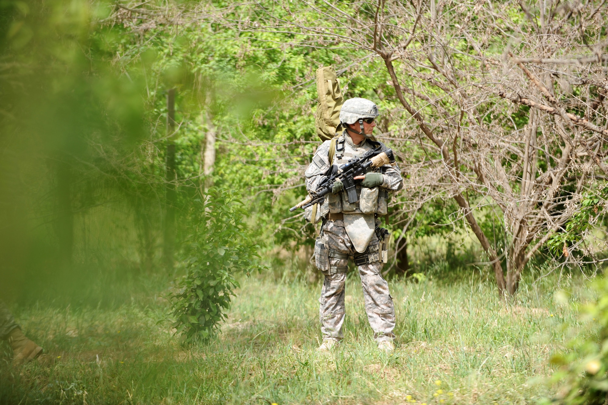 Senior Airman Brian Hafner conducts security during a patrol near Bakr Village April 9 in support of Operation Iraqi Freedom.  He is assigned to the 532nd Security Forces Squadron at Joint Base Balad, Iraq. (U.S. Air Force photo/Staff Sgt. James L. Harper Jr.)