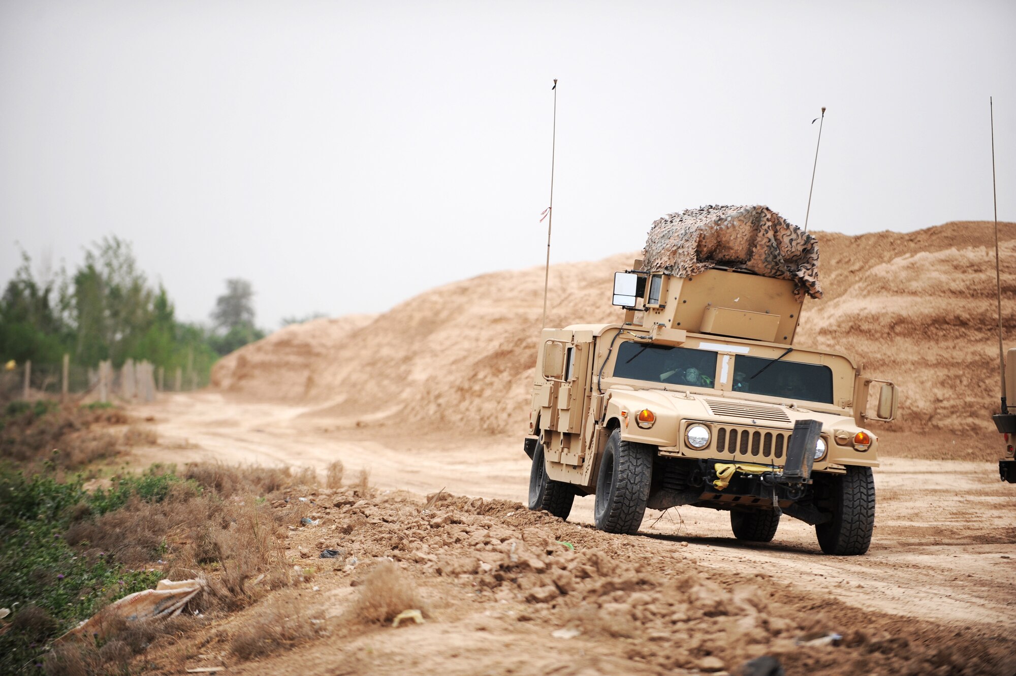 A Humvee patrol from the 532nd Expeditionary Security Forces Squadron conducts security  in the Iraqi village of Bakr April 9 in support of Operation Iraqi Freedom.  (U.S. Air Force photo/Staff Sgt. James L. Harper Jr.)