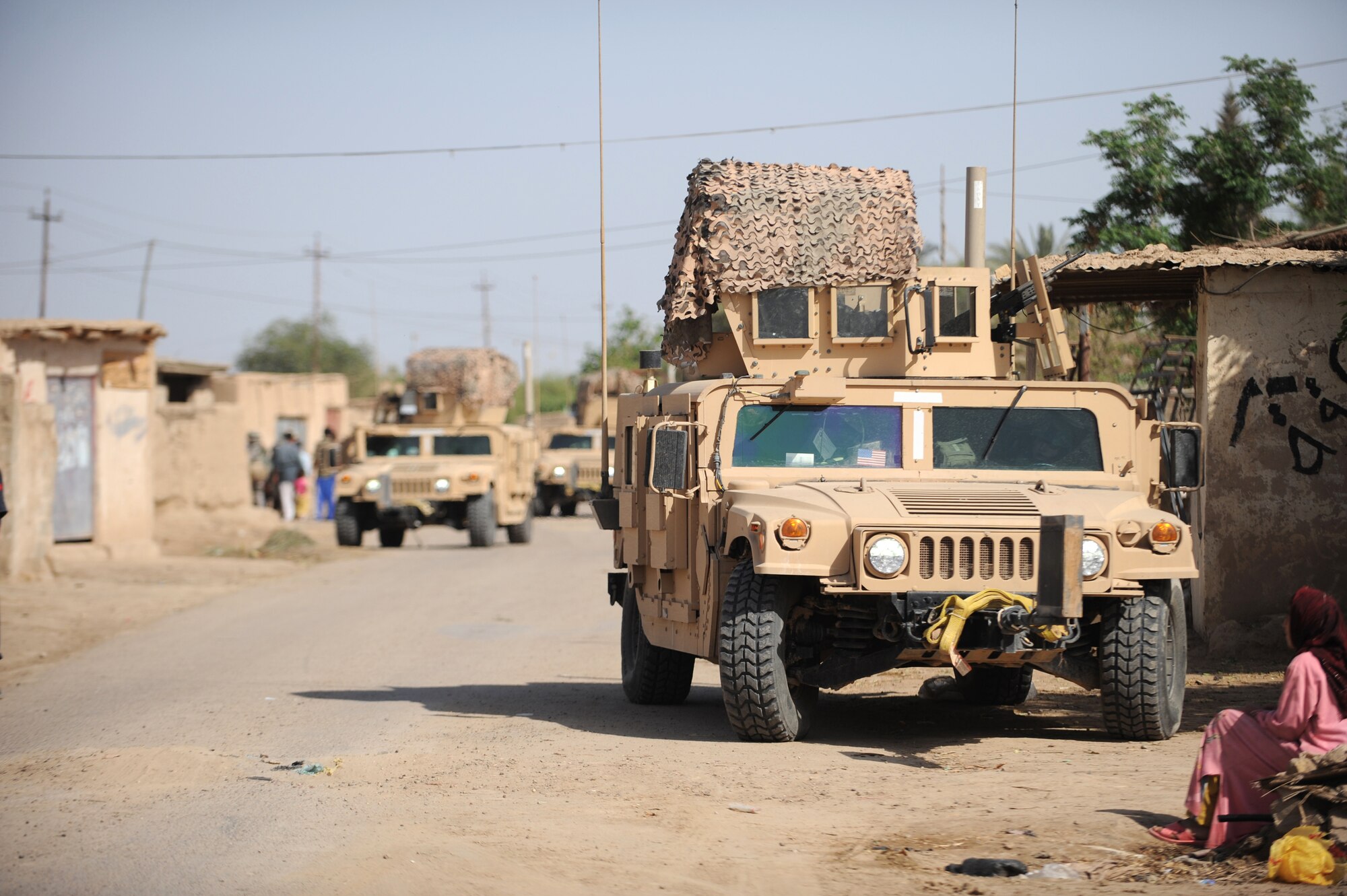 A Humvee patrol from the 532nd Expeditionary Security Forces Squadron at Joint Base Balad, Iraq, conduct security April 9 during a patrol in the village of Abo Atei.  (U.S. Air Force photo/Staff Sgt. James L. Harper Jr.)