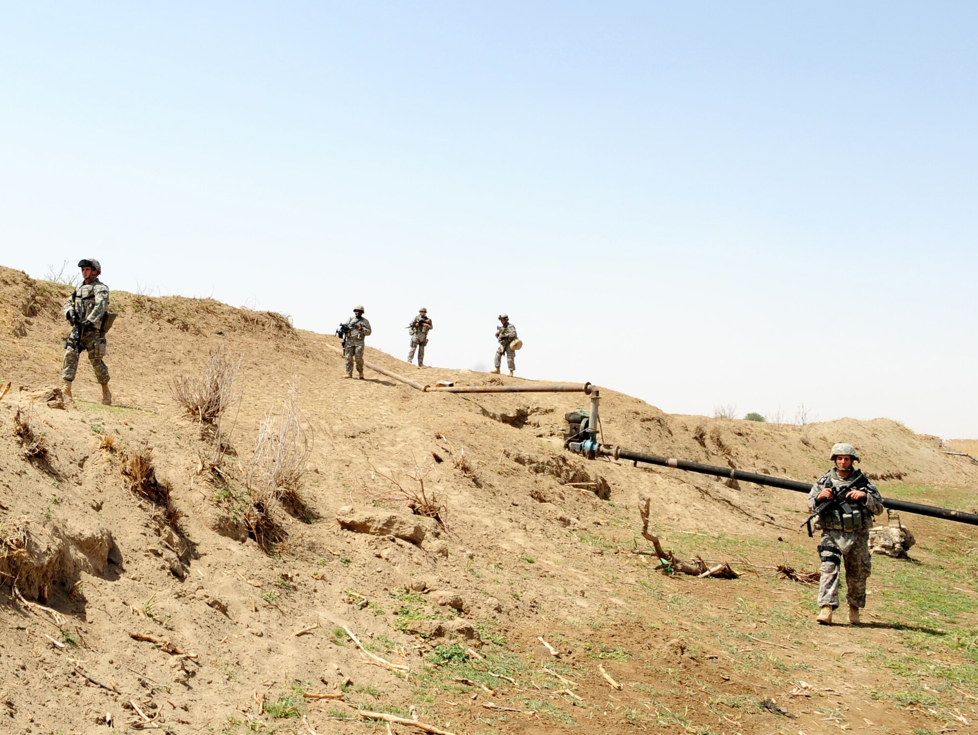 Air Force members of the 532nd Expeditionary Security Forces Squadron at Joint Base Balad, Iraq, conduct a weapons cache sweep April 9 along the the Tigris River.  (U.S. Air Force photo/Staff Sgt. James L. Harper Jr.)