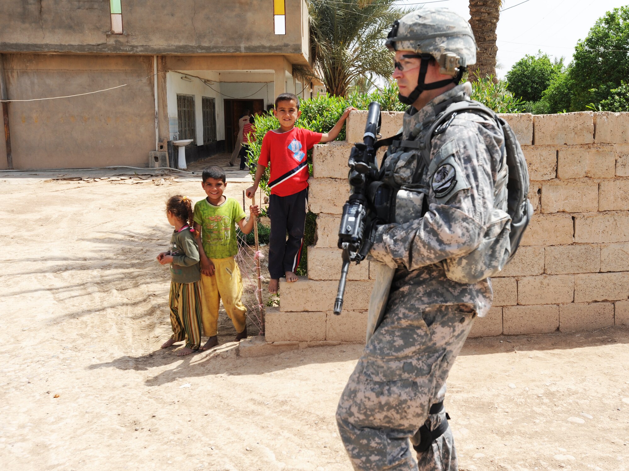 Capt. Steve Ohlmeyer walks down a street April 9 in the village of Albu Hishma. He is assigned to the 532nd Expeditionary Security Forces Squadron as the quick reaction force officer in charge.  (U.S. Air Force photo/Staff Sgt. James L. Harper Jr.) 