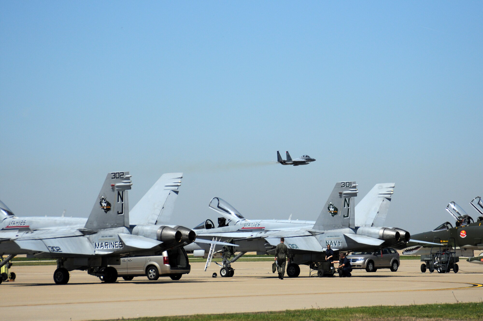 An F-15 Eagle flies over the Kentucky Air National Guard flightline on April 17.  Many planes were assembled at the Kentucky Air Guard on Thursday and Friday in preparation for this weekend's Thunder Over Louisville air show. (USAF photo by Tech. Sgt. Phil Speck.)