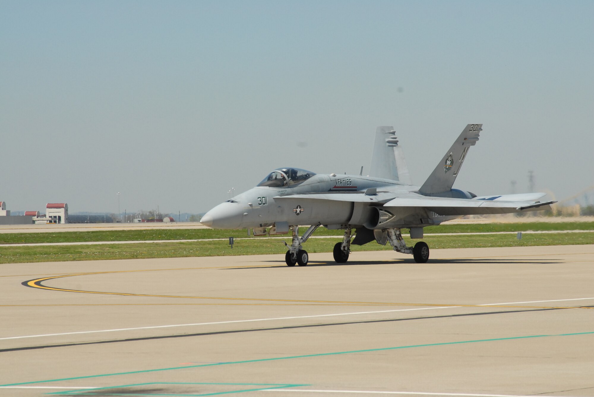 An F-18 Hornet taxis on the tarmac at the Kentucky Air National Guard base as it prepares to practice aerobatics for the Thunder Over Louisville air show. (USAF photo by Senior Airman Malcolm Byrd.)