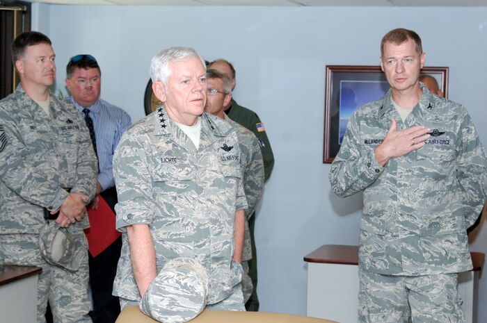 Col. John "Red" Millander speaks with Gen. Arthur Lichte about the newly opened Airmen Ministry Center and Internet Cafe during his visit to Charleston AFB April 16. General Lichte toured various base facilities and spoke with Airmen to discuss any issues they had on their minds. General Lichte is the commander of Air Mobility Command, Scott AFB, Ill. Colonel Millander is the 437th Airlift Wing commander. (U.S. Air Force photo/Staff Sgt. Marie Cassetty)