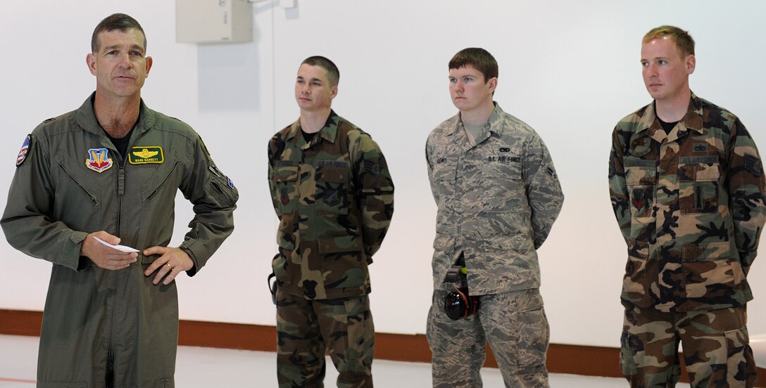 LANGLEY AIR FORCE BASE, Va. – Brig. Gen. Mark A. Barrett, 1st Fighter Wing commander announces the winners of a load crew competition here April 17. Load crew of the first quarter award went to the 27th Aircraft Maintenance Unit for their accuracy, efficiency and speed. (U.S. Air Force photo/Airman 1st Class Gul Crockett)